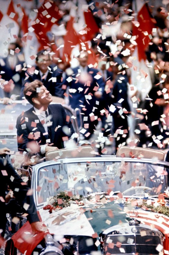 President John F. Kennedy in the midst of a ticker tape parade during a state visit to Mexico, 1962.