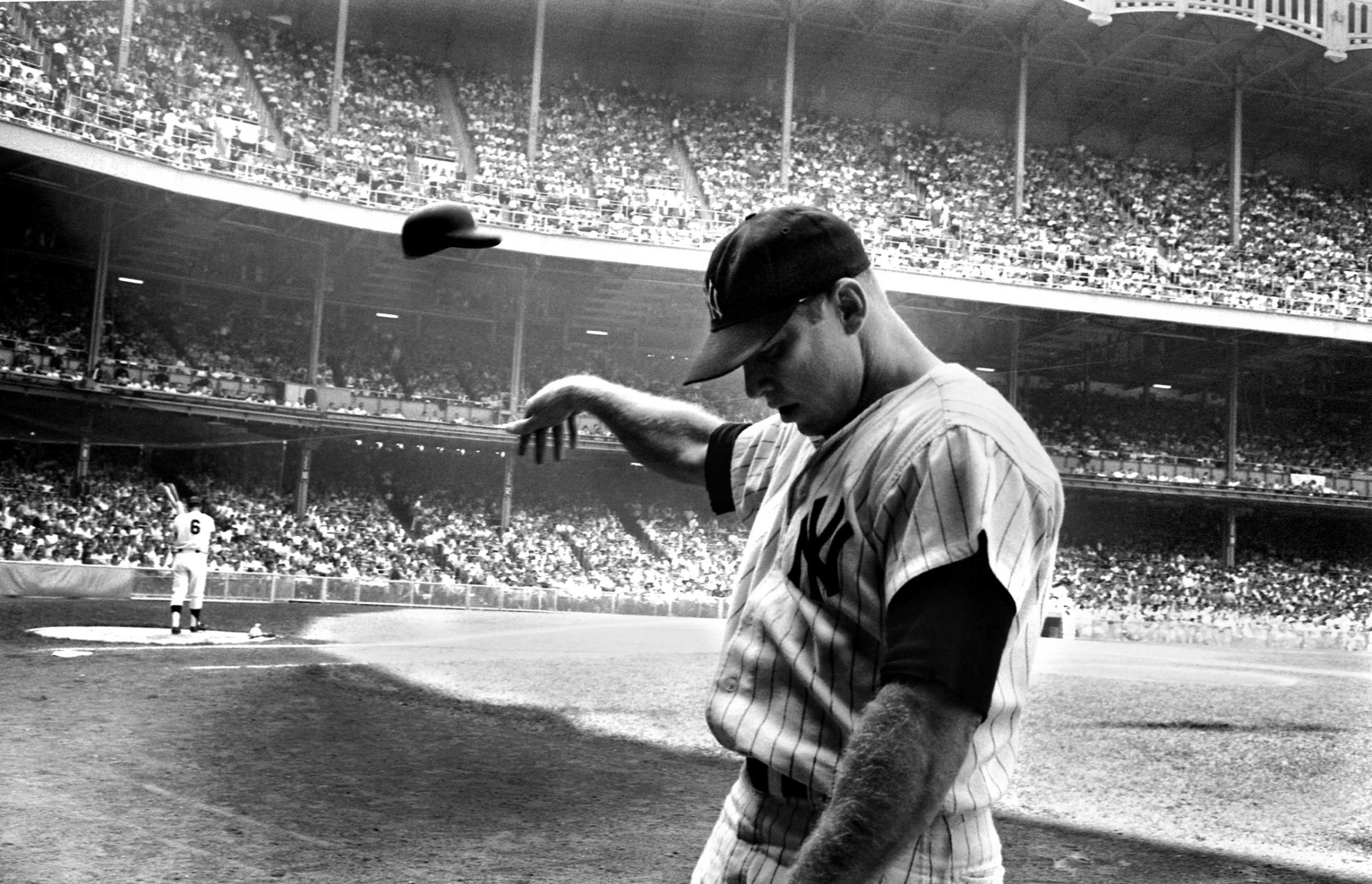 Mickey Mantle tosses his helmet in disgust after a terrible at-bat, New York, 1965.