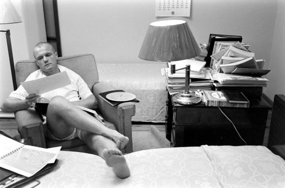 John Glenn does his astronauts' homework, Florida, 1959.