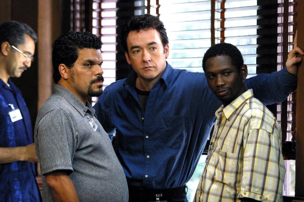 From Left: Nestor Serrano, John Cusack and Guy Torry in 'Runaway Jury' in 2003.