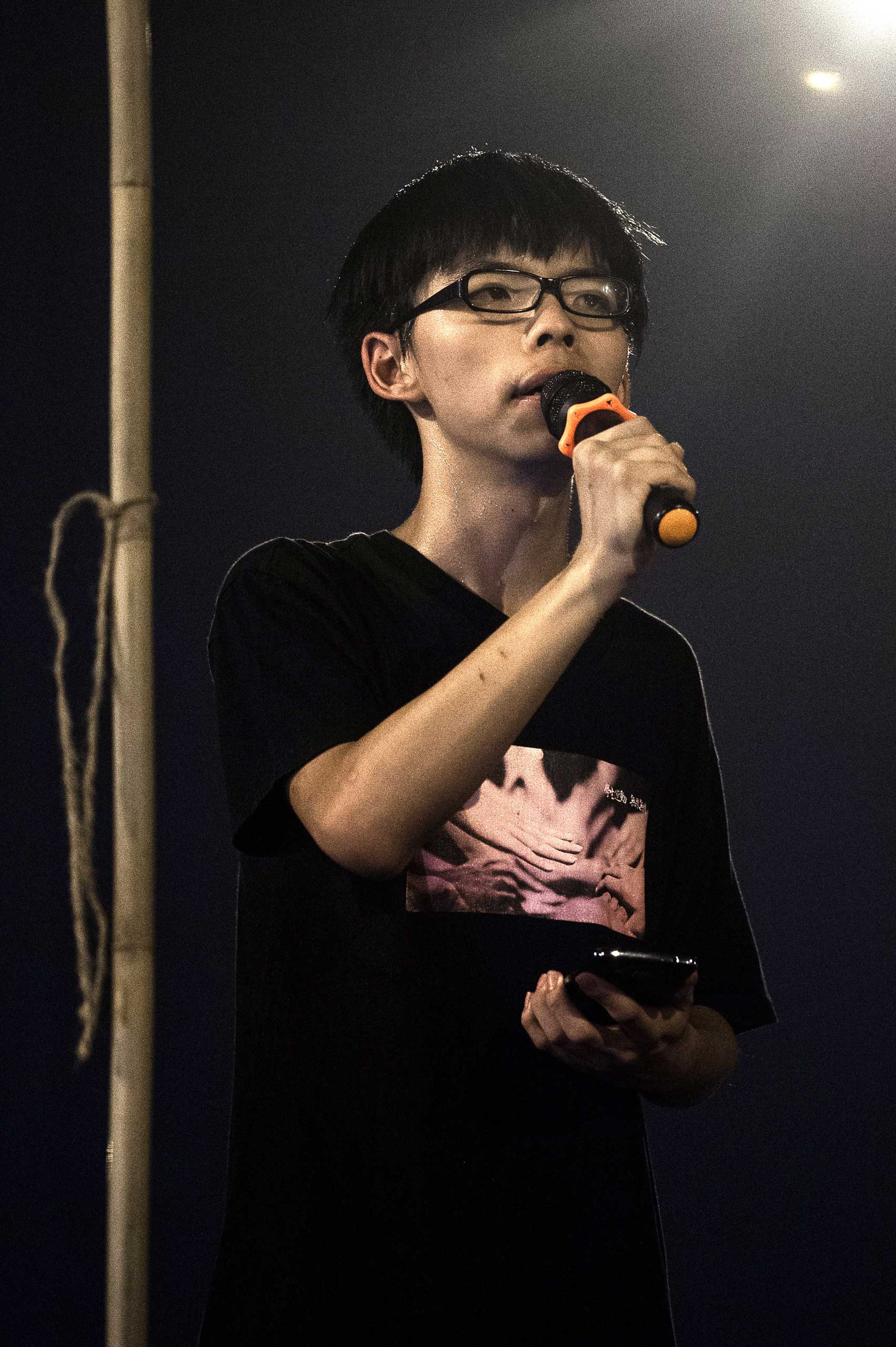 Joshua Wong, leader of the student pro-democracy group scholarism addresses demonstrators after the press conference of Hong Kong Chief Executive Leung Chun-ying in Hong Kong on October 2, 2014. Hong Kong's embattled leader rejected protesters' calls for him to resign, but in a significant concession agreed to talks with a students group involved in mass pro-democracy demonstrations that have paralysed parts of the city.AFP PHOTO / Philippe Lopez (Photo credit should read PHILIPPE LOPEZ/AFP/Getty Images)