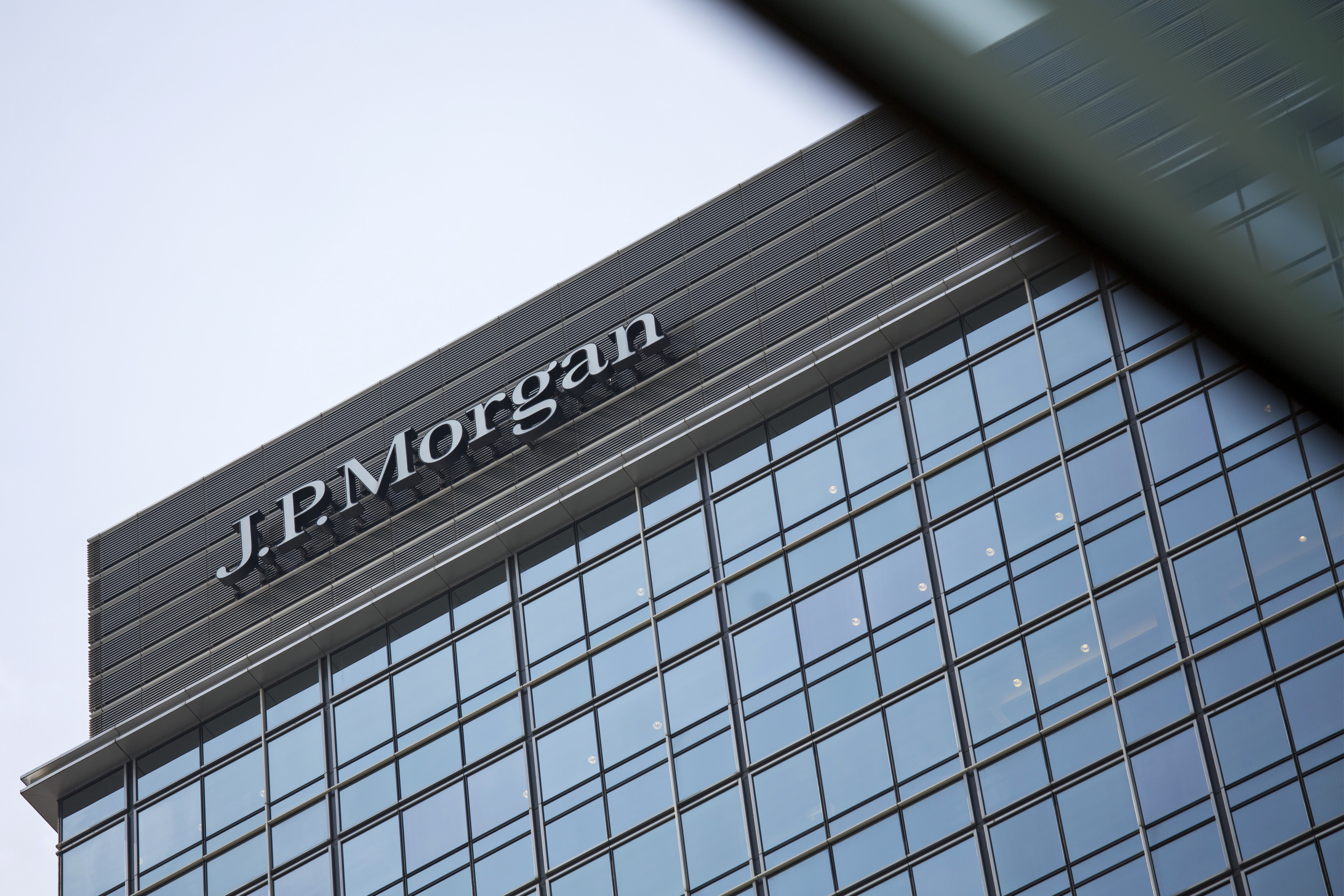 Signage for JP Morgan Chase is displayed atop Chater House in the central business district of Hong Kong on Aug. 29, 2013 (Bloomberg/Getty Images)
