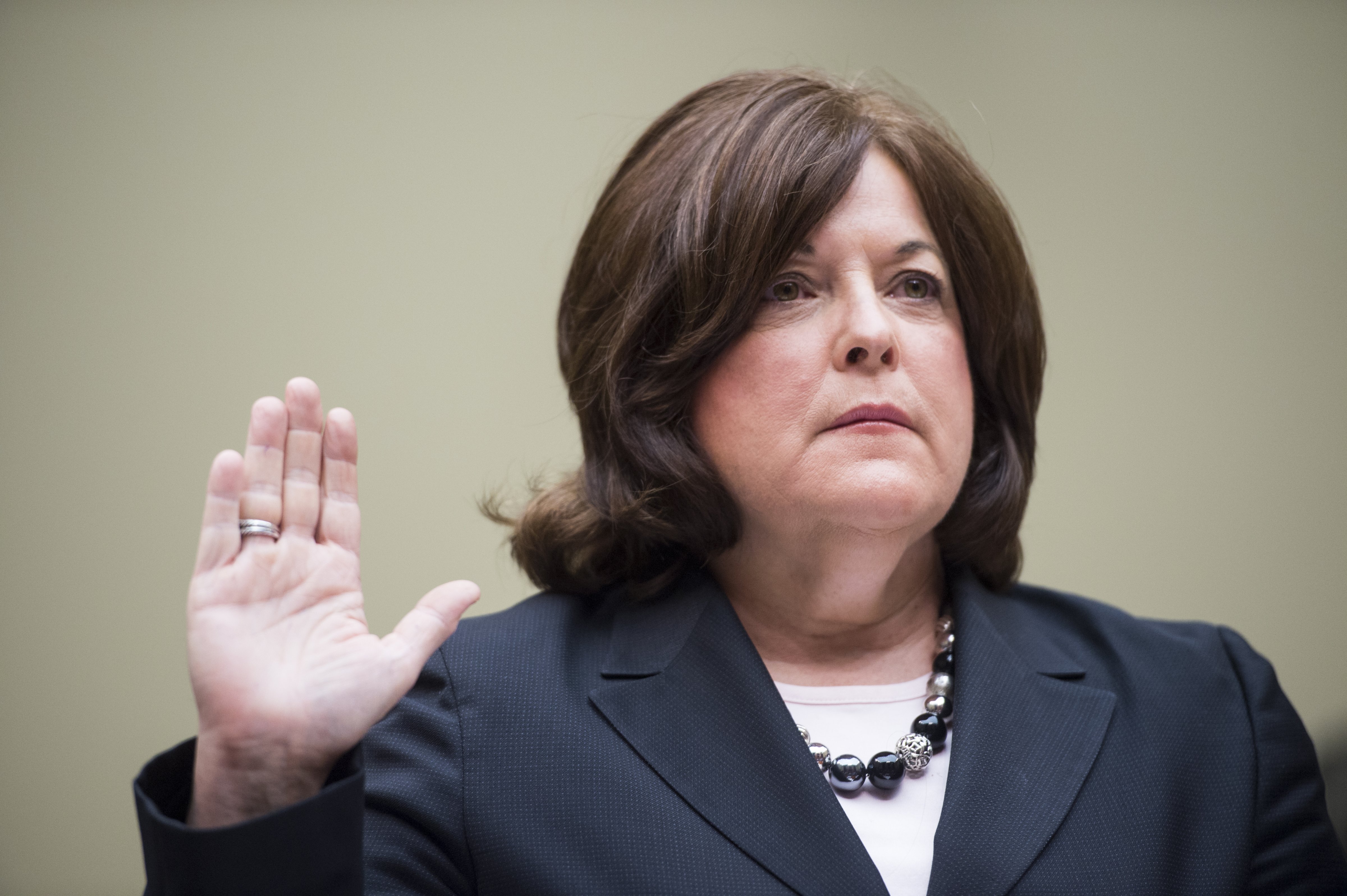 Secret Service Director Julia Pierson is sworn in before testifying during the House Oversight and Government Reform Committee hearing on "White House Perimeter Breach: New Concerns about the Secret Service" on Sept. 30, 2014. (Bill Clark—CQ-Roll Call)