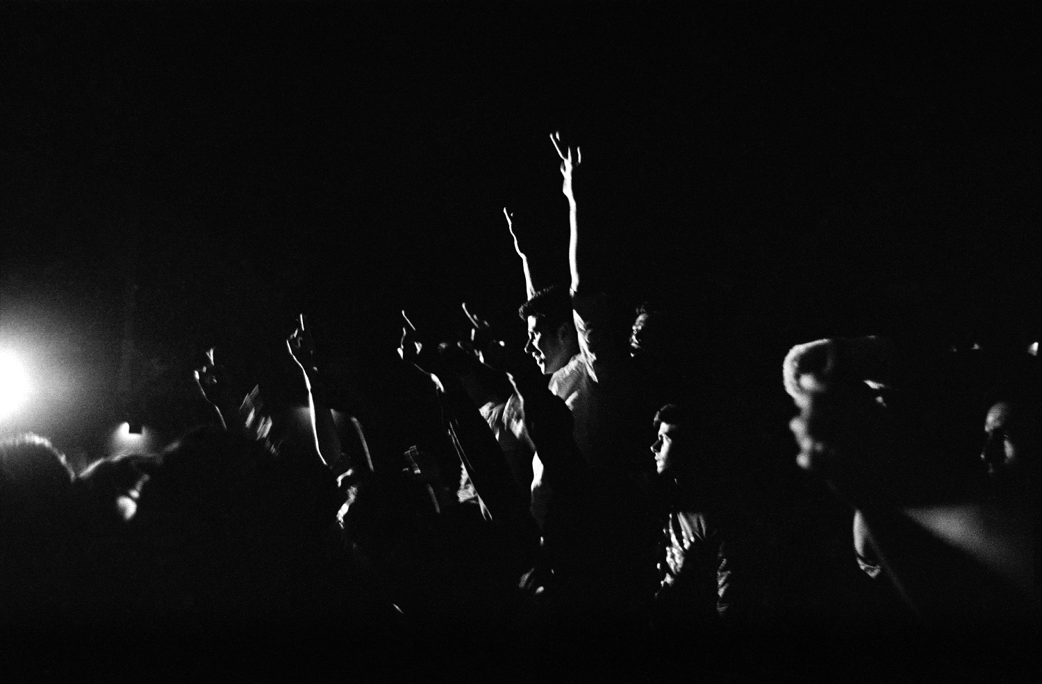 Young men cheer during a performance of the heavy metal band District Unknown at the Institut Français d’Afghanistan during the Sound Central Music Festival.