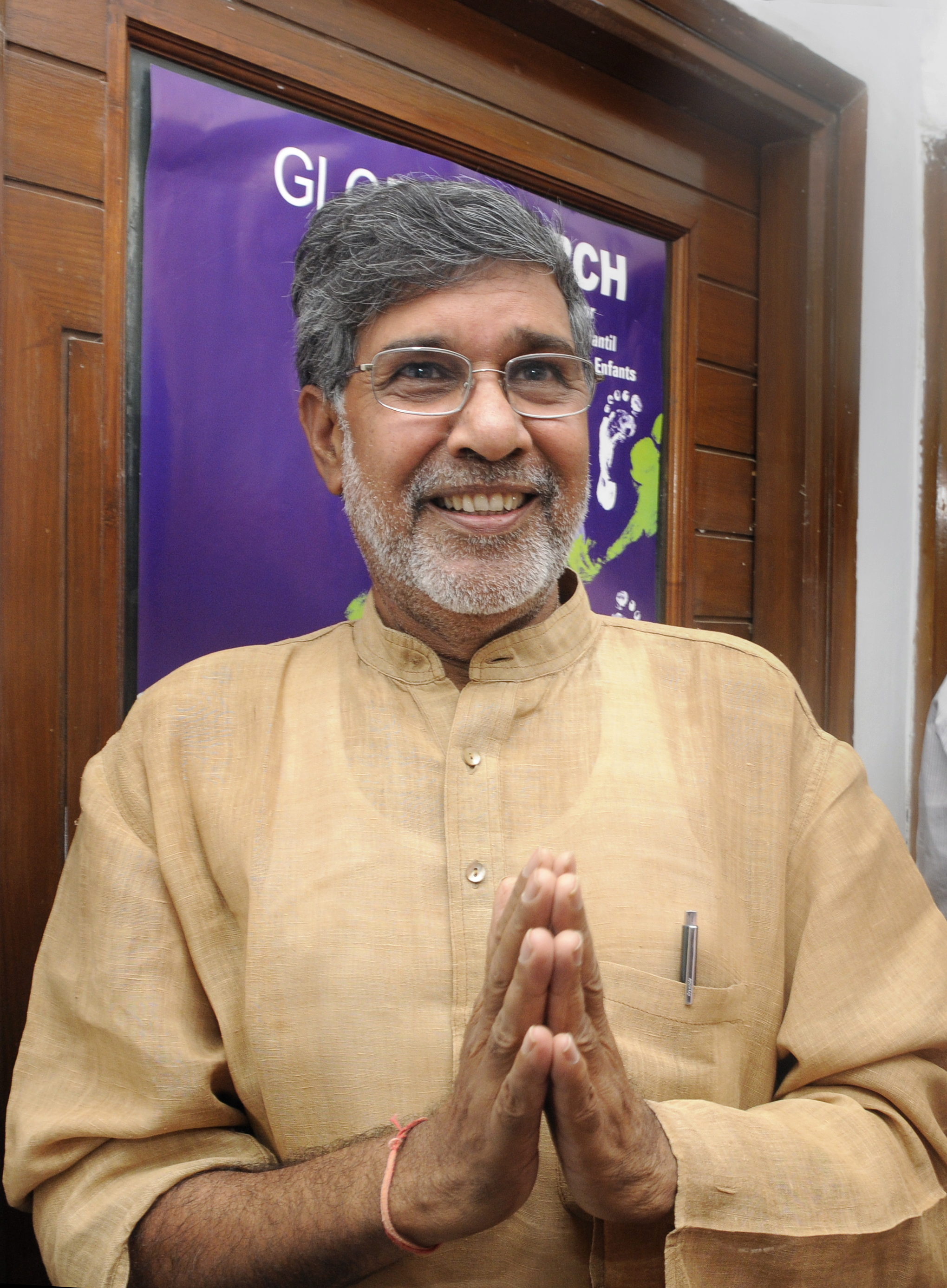 Indian childrens right activist and 2014 Nobel peace prize laureate Kailash Satyarthi greets media persons and well-wishers at his residence after the announcement of prize on October 10, 2014 in New Delhi, India. (Hindustan Times—Hindustan Times via Getty Images)