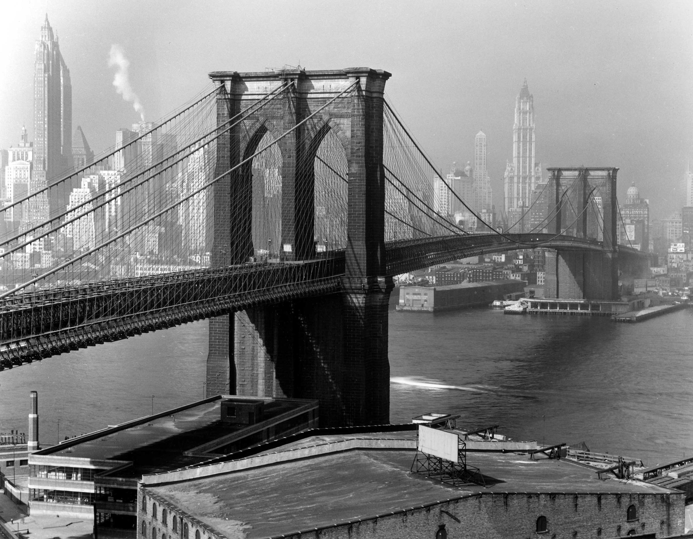 The Brooklyn Bridge arches toward Lower Manhattan, 1948.