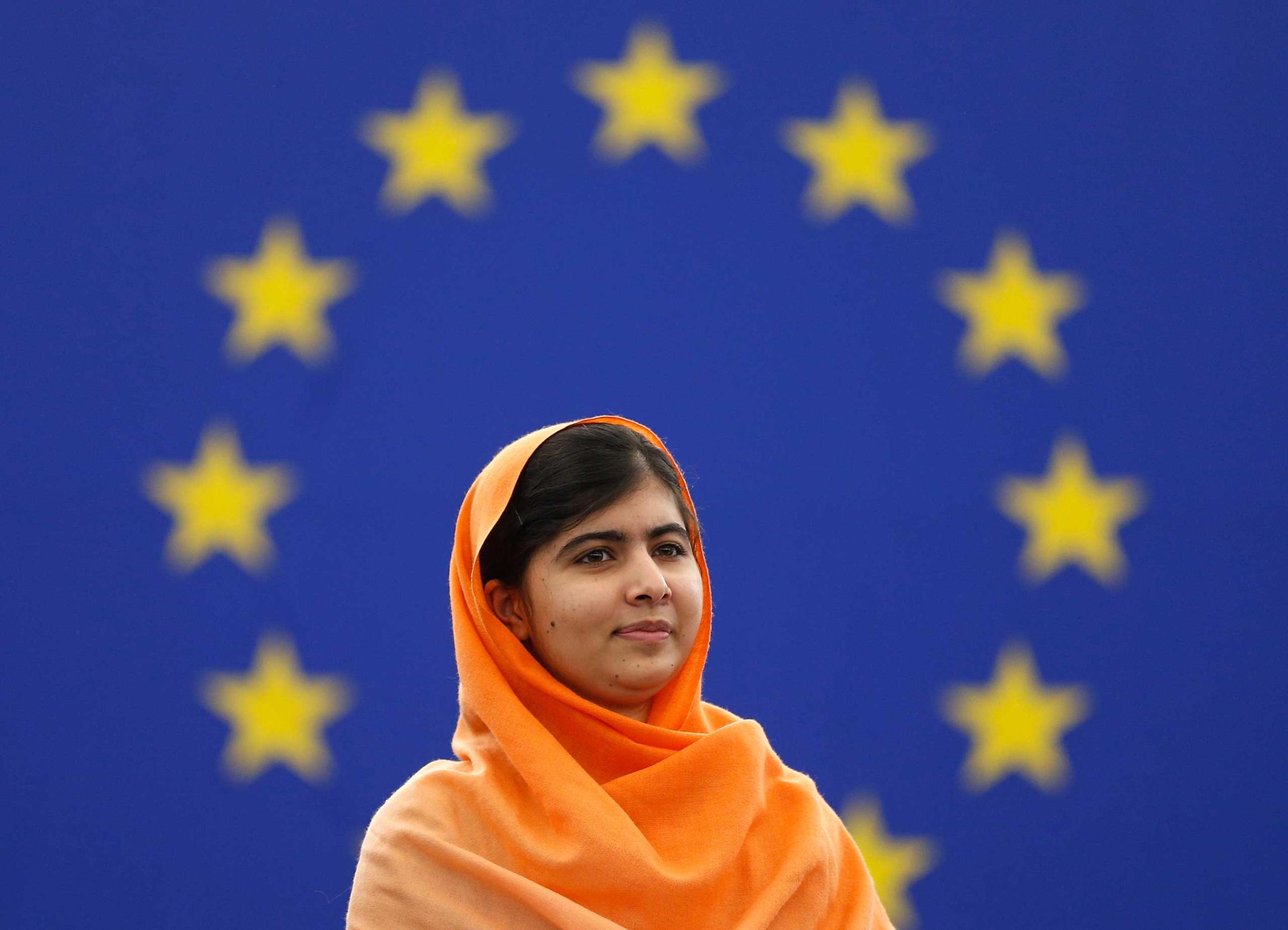 Pakistani teenage activist Malala Yousafzai, who was shot in the head by the Taliban for campaigning for girls' education, attends an award ceremony to receive her 2013 Sakharov Prize in Strasbourg