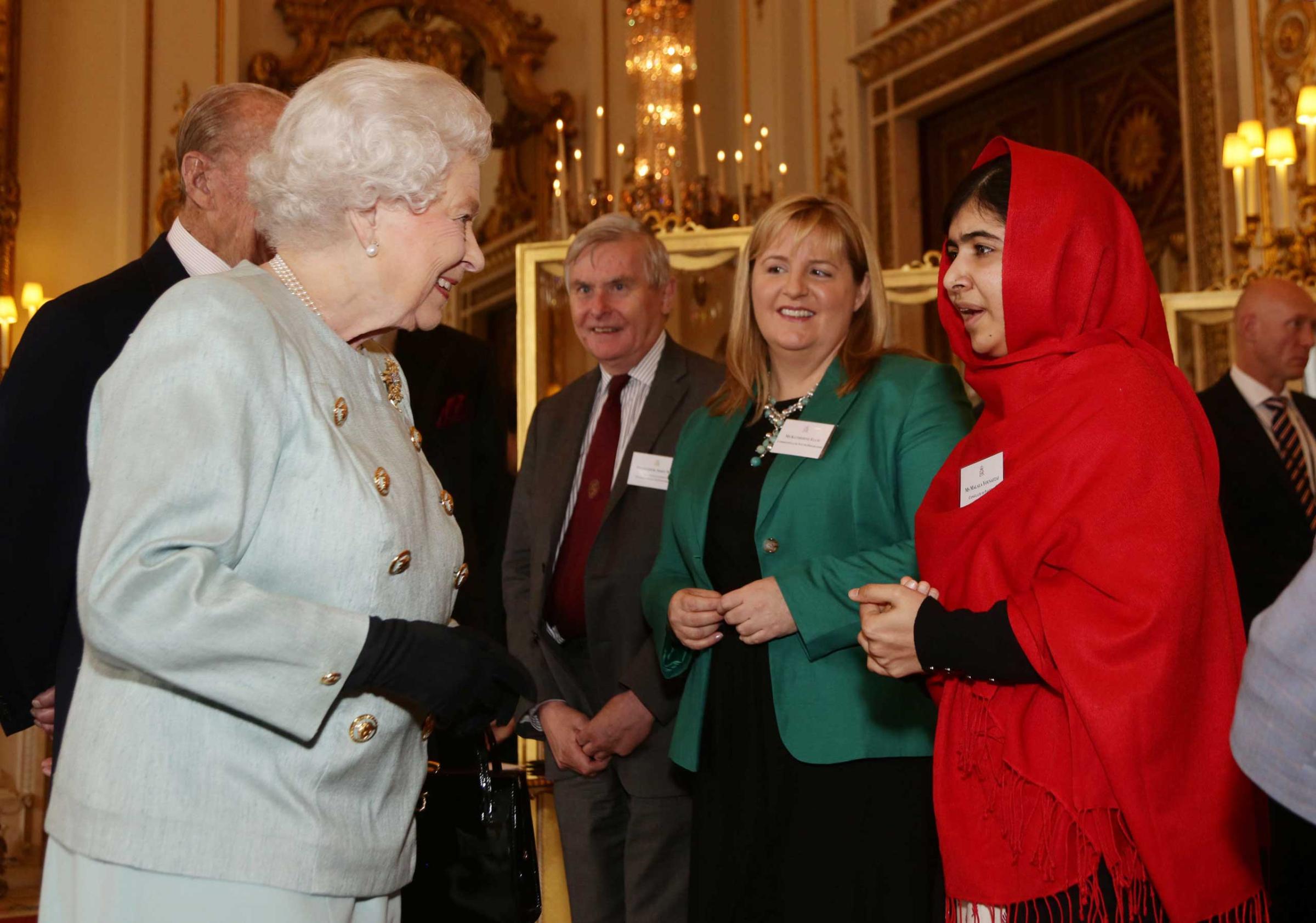 Queen Elizabeth II Receives Malala At Buckingham Palace