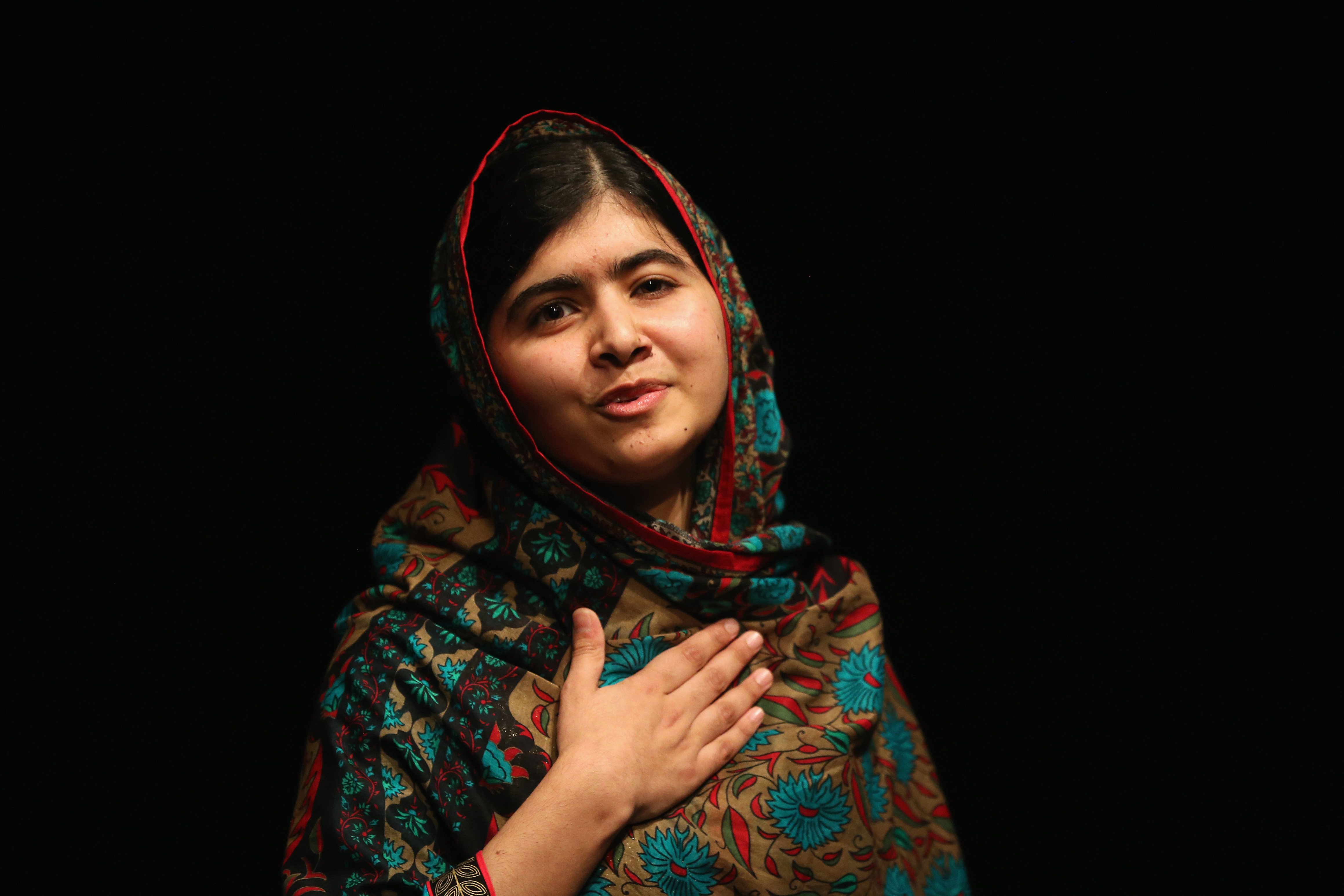 Malala Yousafzai acknowledges the crowd at a press conference at the Library of Birmingham after being announced as a recipient of the Nobel Peace Prize on Friday. (Christopher Furlong—Getty Images)