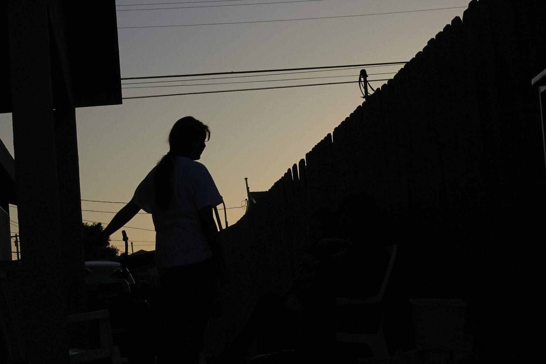 At dusk in Los Angeles, Maria, 15, waits for word on 
                      her plea for asylum from extortion and gang threats in El Salvador. (Alexis Kenyon—Center for Public Integrity)