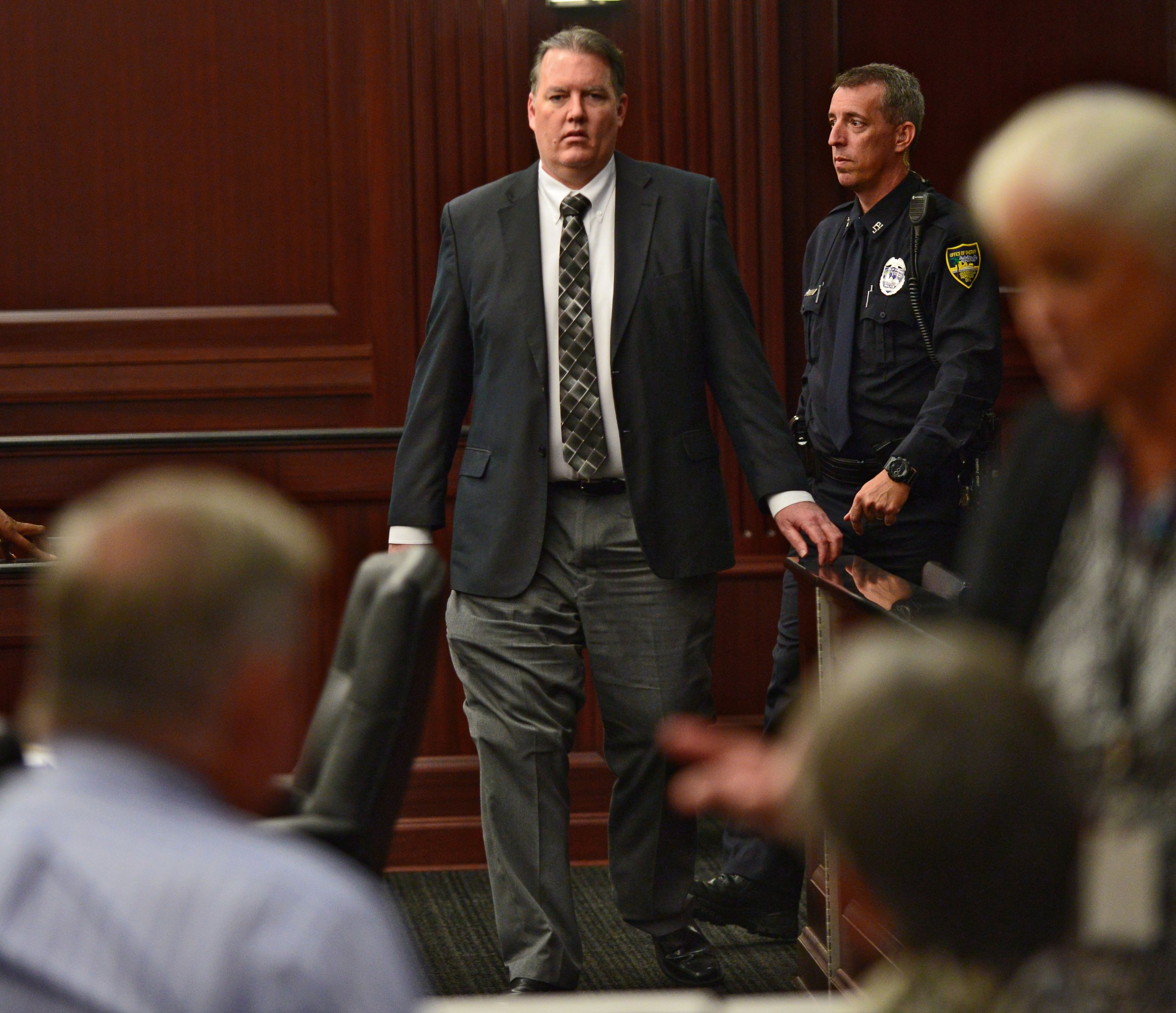 Defendant Michael Dunn walks back into the courtroom after a short afternoon break during his trial in the Duval County Courthouse in Jacksonville, Fla. on Sept. 27, 2014.