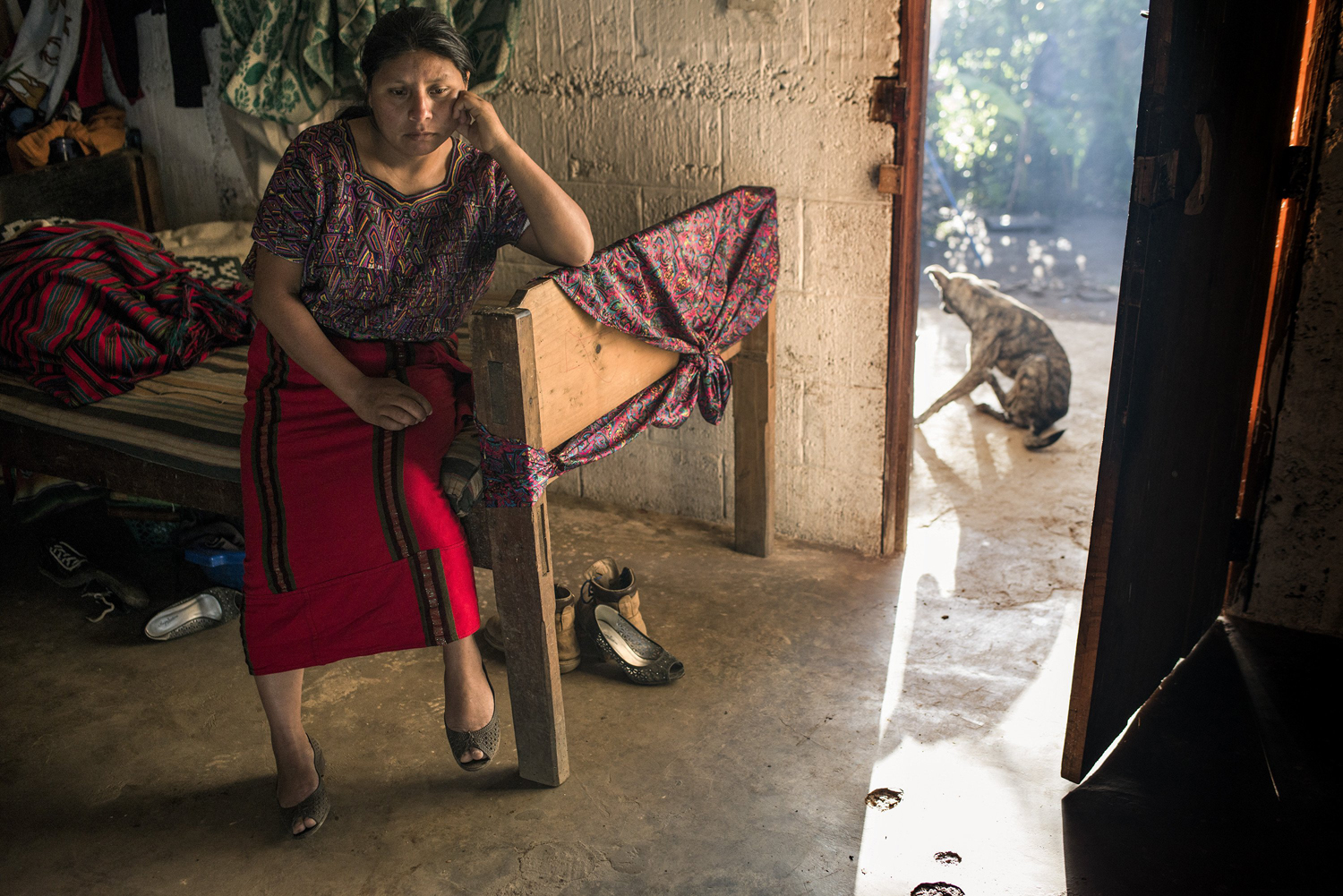 The mother of Cecilia, 16, a Guatemalan seeking a better life in the U.S., who fell prey to smugglers, in the home 10 family members share in El Paraiso, Guatemala, July 30, 2014.
