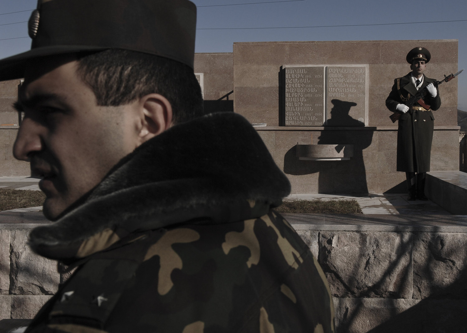 Karabakhi soldiers stand guard at a war memorial in Kharamort, a village that was once evenly populated by ethnic Azeris and Armenians. The village is now half the size since the Azeris fled and their homes were burned.