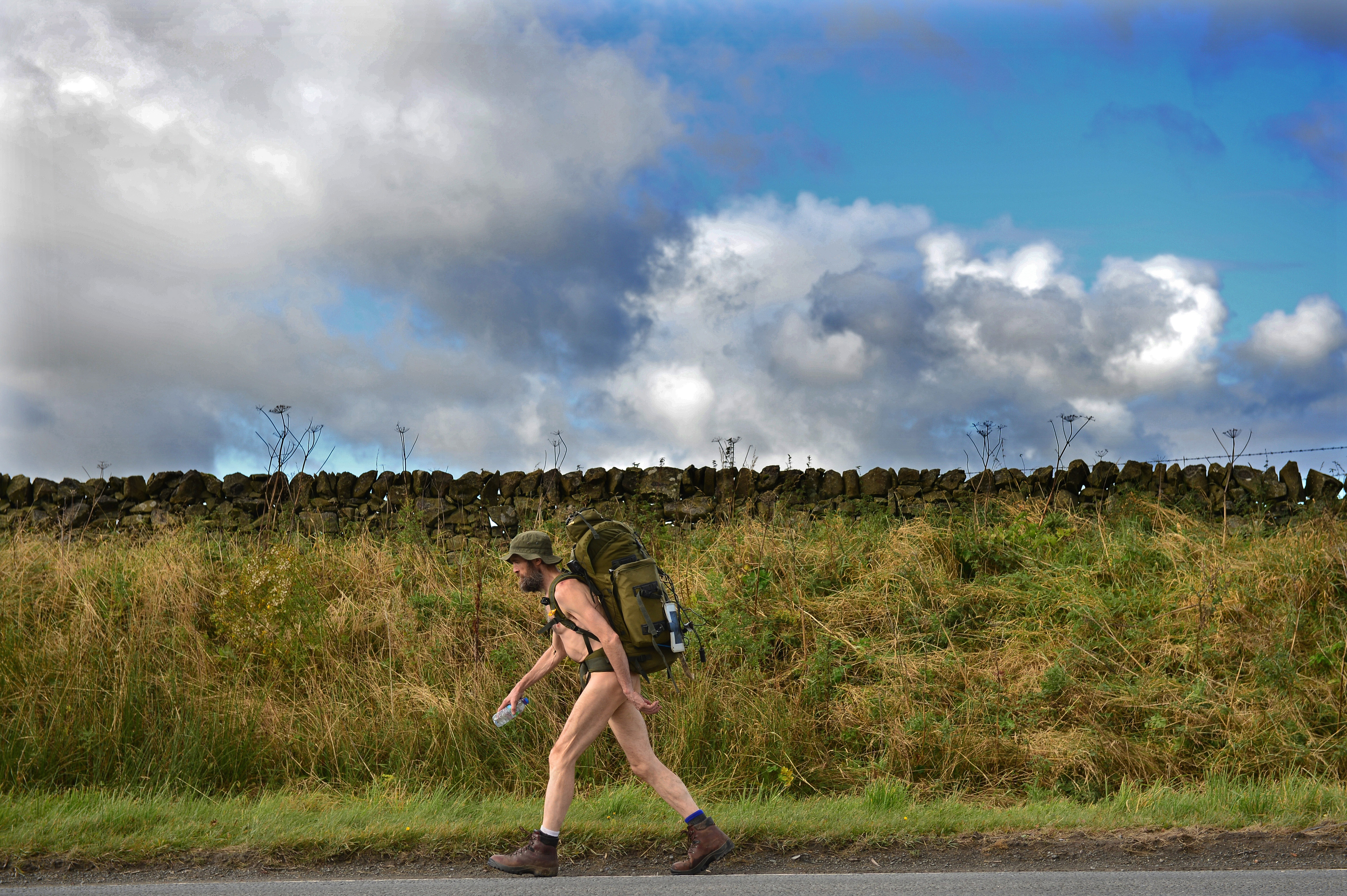 Stephen Gough the naked rambler makes his way south through Scotland following his release from Saughton Prison yesterday after serving his latest sentence on Oct. 6, 2012 in Peebles, Scotland. (Jeff J Mitchell—Getty Images)