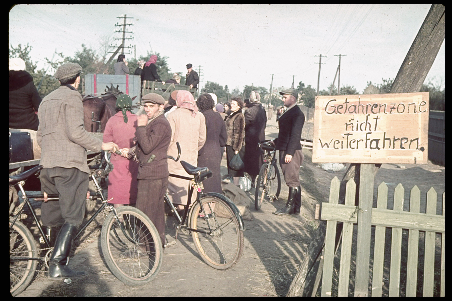 Refugees near Warsaw during the 1939 German invasion of Poland. (Sign reads, 'Danger Zone -- Do Not Proceed.')