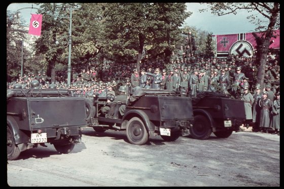 German victory parade in Warsaw after the invasion of Poland, 1939. (Hitler is on platform, arm raised in Nazi salute.)
