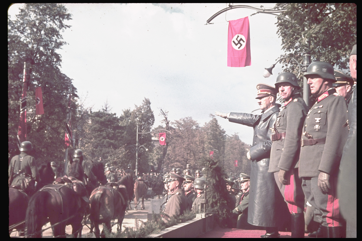 Adolf Hitler views victory parade in Warsaw after the German invasion of Poland, 1939.