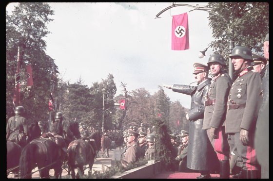 Adolf Hitler views victory parade in Warsaw after the German invasion of Poland, 1939.