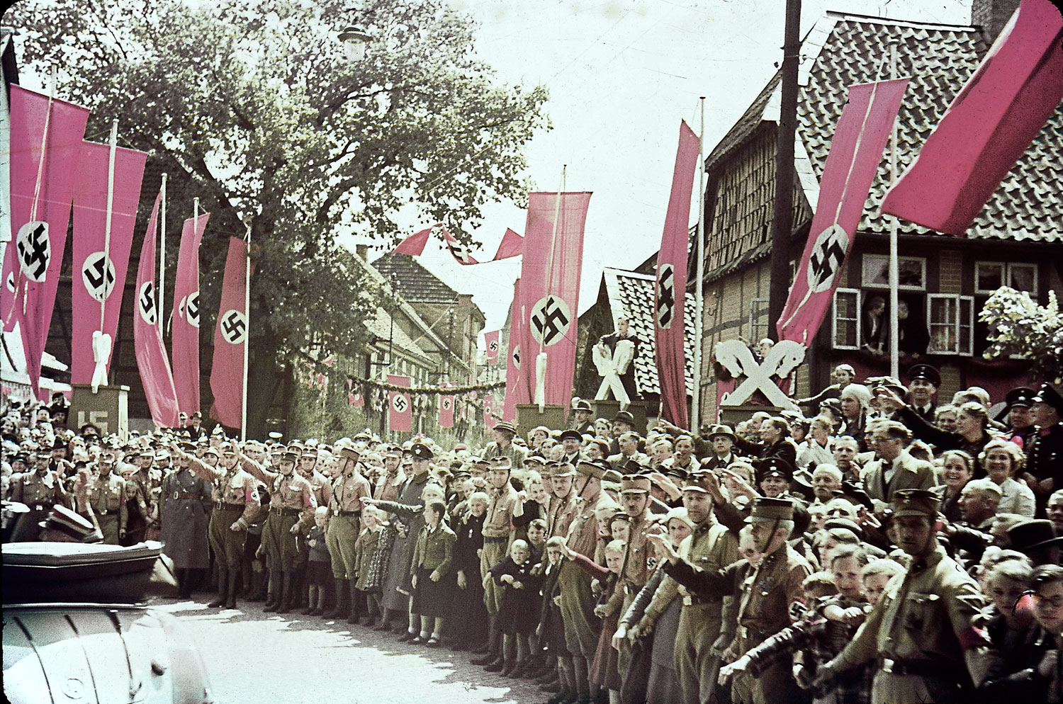 Scene along roadway to the Fallersleben Volkswagen Works cornerstone ceremony, Germany, 1938.