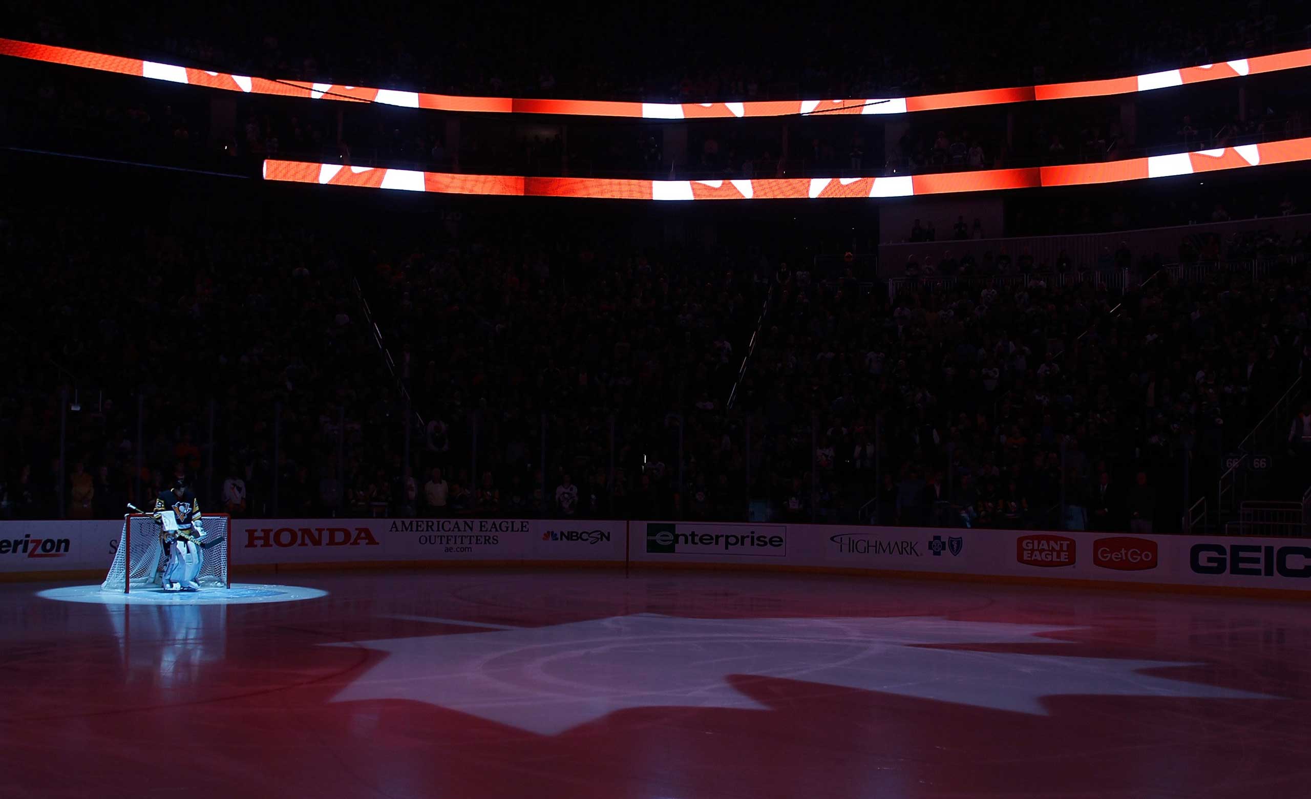 The Canadian National Anthem is performed in honor of the shooting victims in Ottawa during the game between the Philadelphia Flyers and Pittsburgh Penguins at Consol Energy Center on Oct. 22, 2014 in Pittsburgh, Pa. (Gregory Shamus—NHLI/Getty Images)