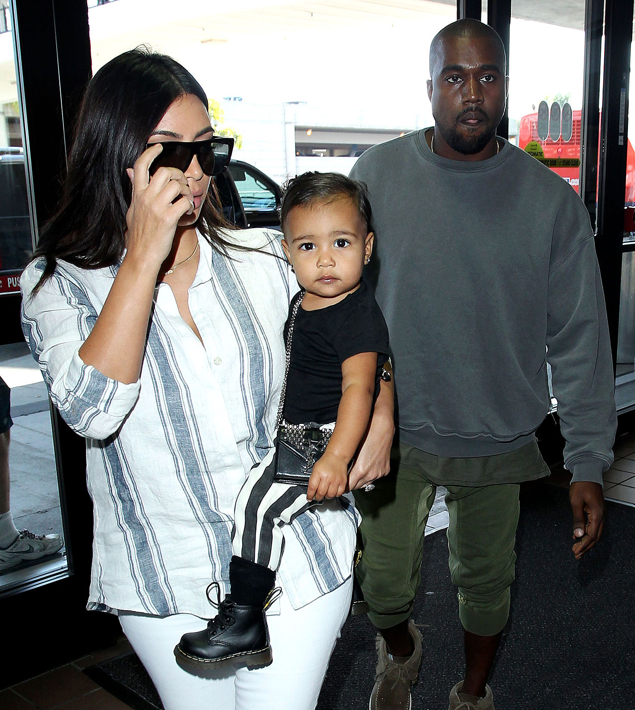 Kim Kardashian, Kanye West and baby North West at the Los Angeles International Airport ***NO DAILY MAIL SALES***