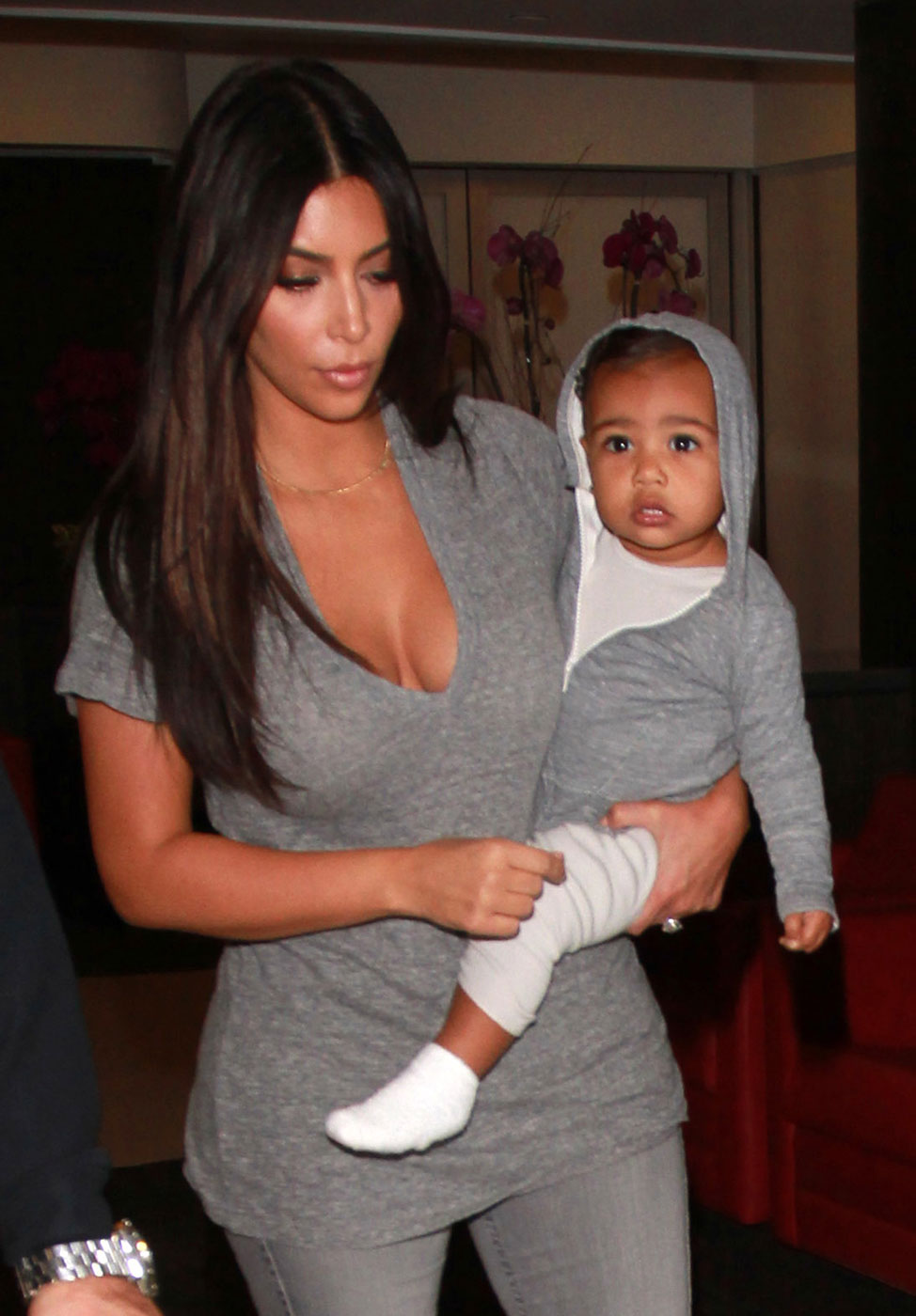 Kim Kardashian takes baby North West on a late night flight from LAX Airport in Los Angeles, CA, on August 10, 2014.