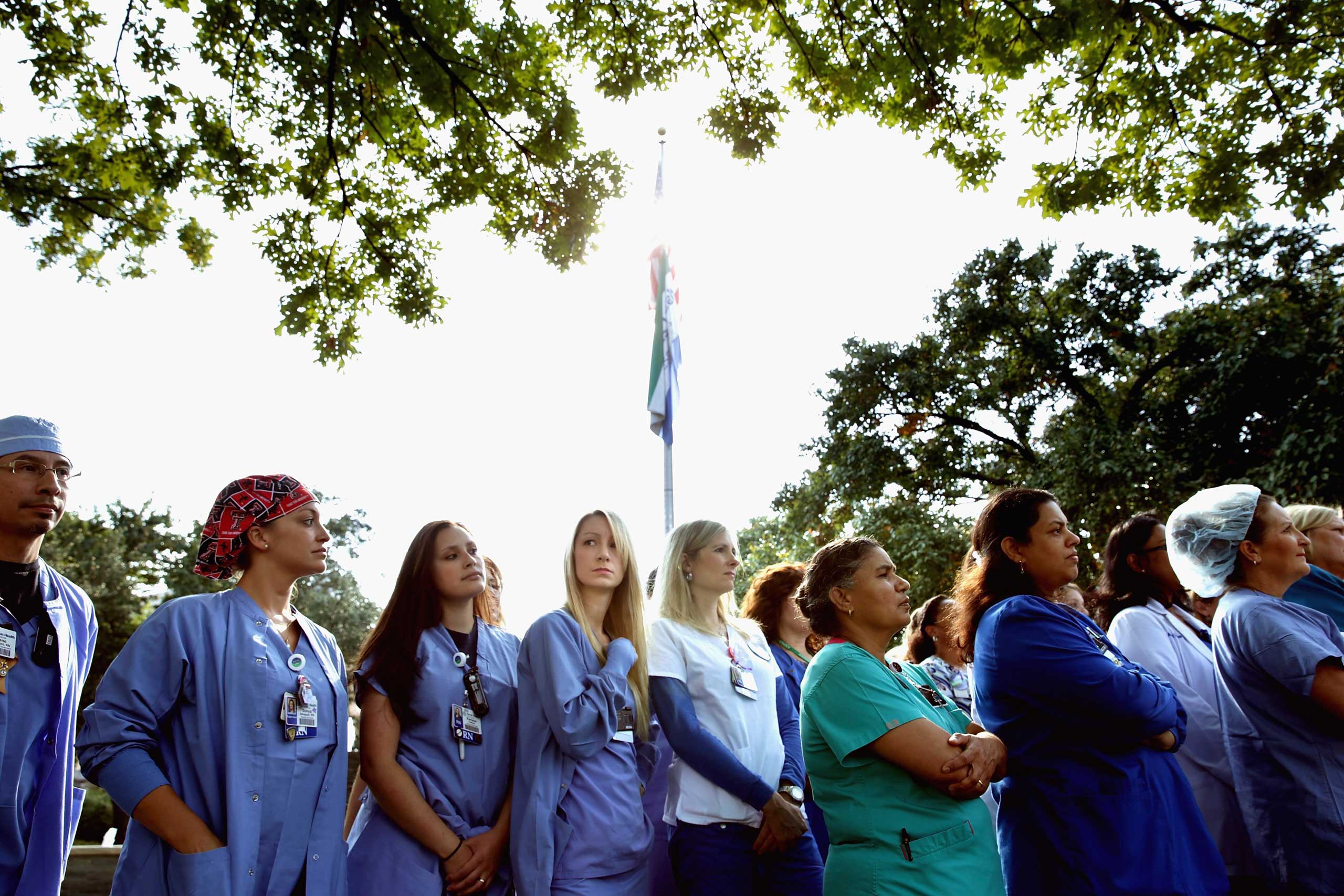 Several dozen nurses from Texas Health Presbyterian Hospital gathered in front of the hospital to show support for their employer, Oct. 20, 2014 in Dallas. (Chip Somodevilla—Getty Images)
