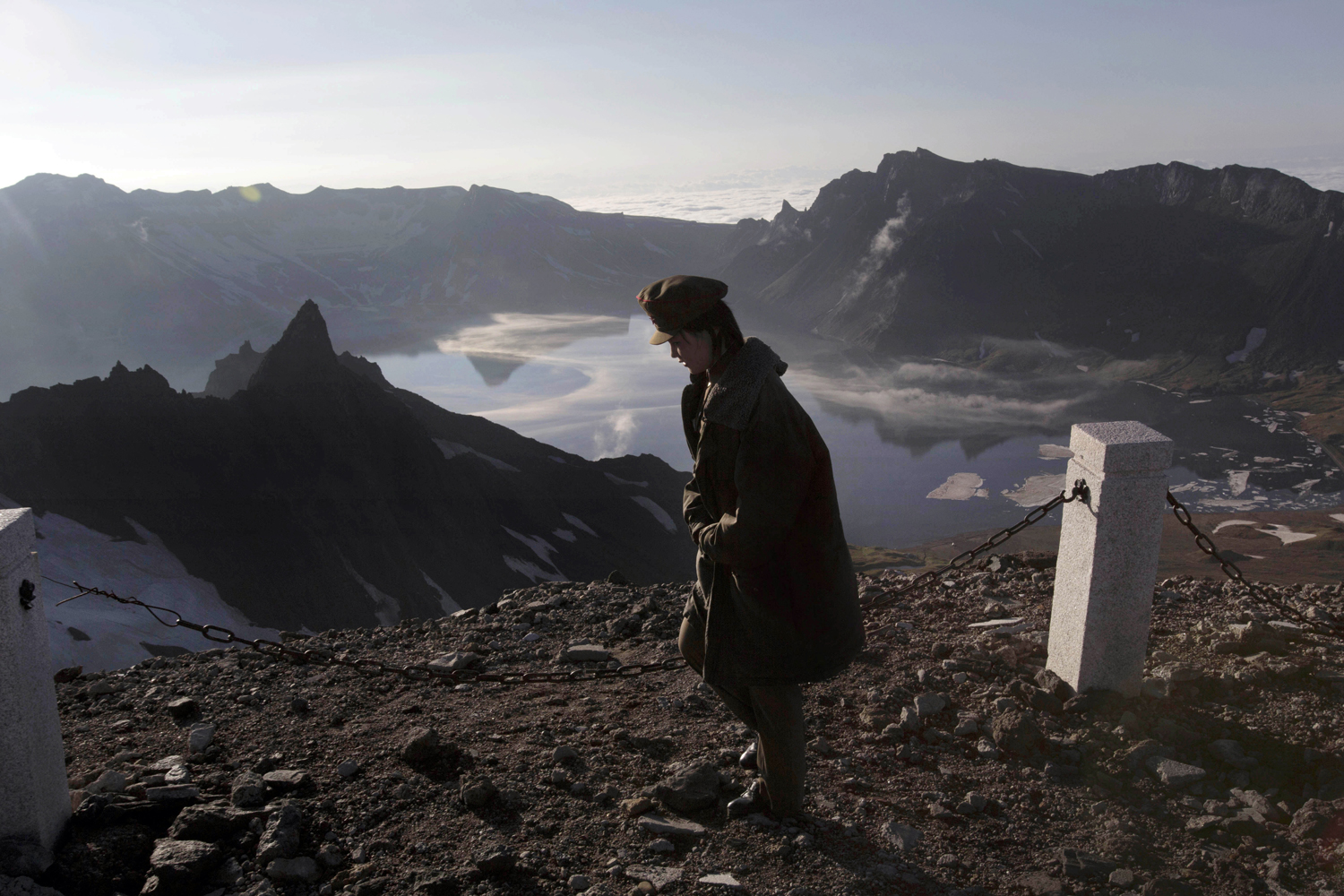 A North Korean woman walks on the peak of Mt. Paektu in North Korea's Ryanggang province, June 18, 2014 .