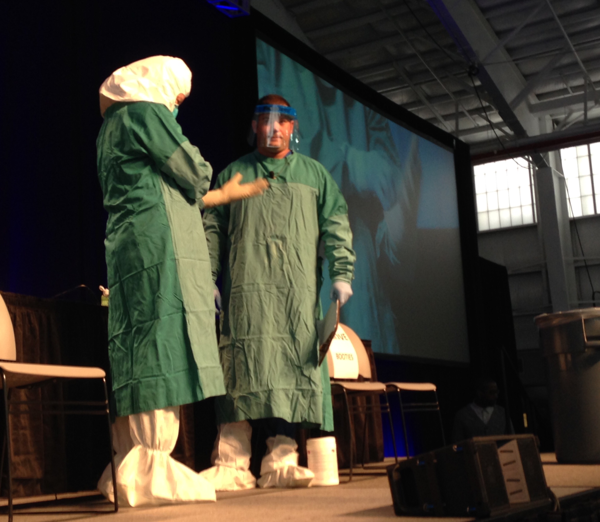 CDC and Mount Sinai health workers demonstrate how to put on and off Ebola personal protective equipment at an Ebola education session in New York City (Alexandra Sifferlin)