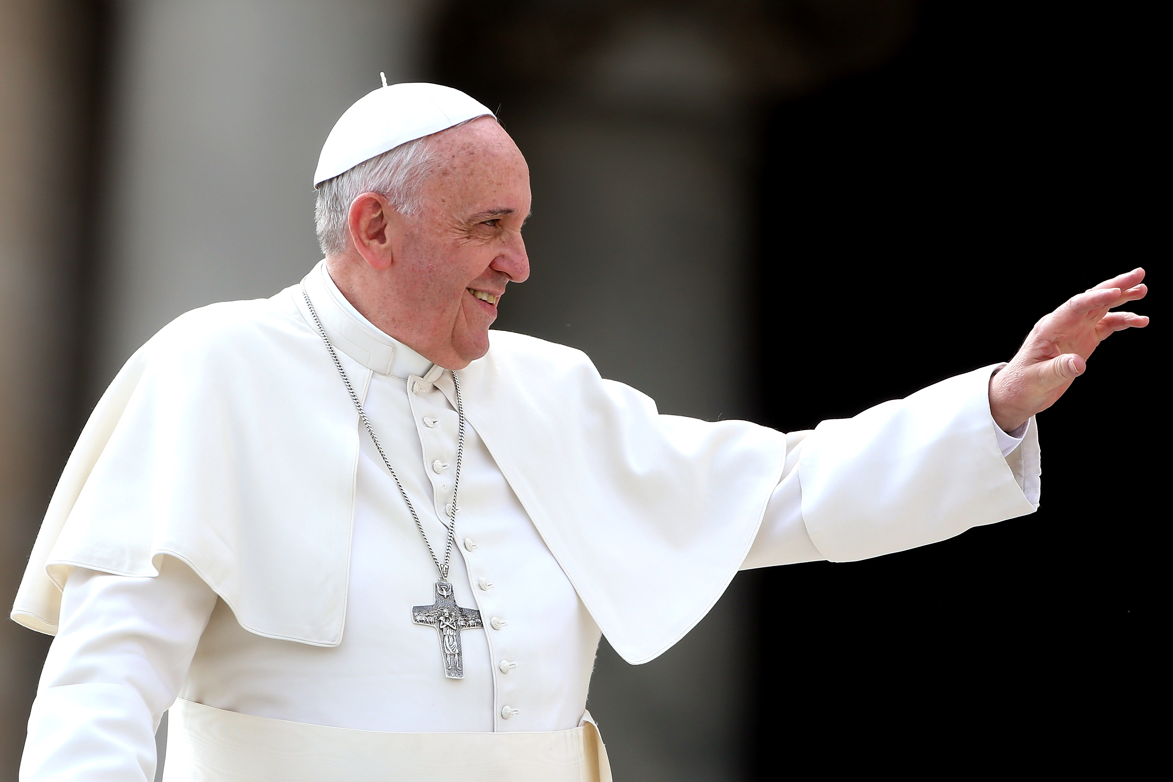 Pope Francis waves to the faithful as he holds his weekly audience in St. Peter's Square on March 19, 2014 in Vatican City, Vatican. (Franco Origlia—Getty Images)