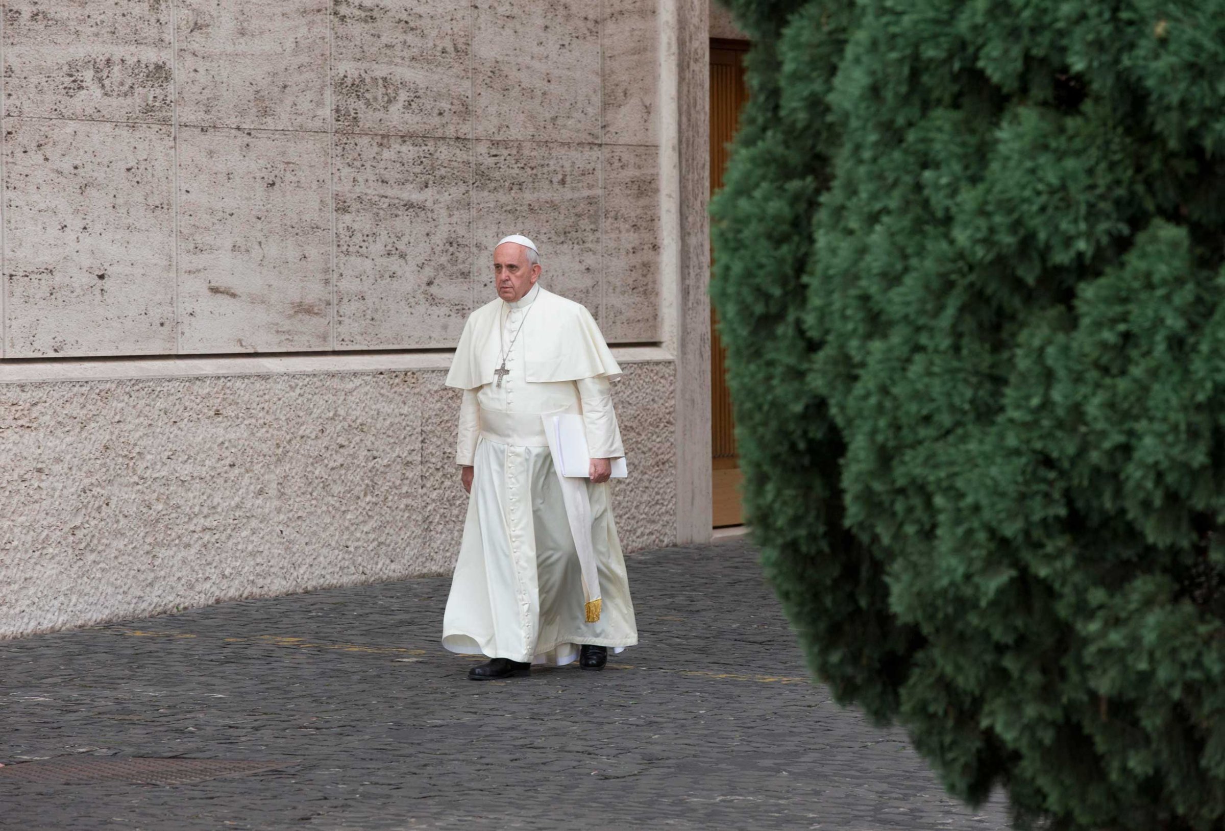 Pope Francis arrives at a morning session of a two-week synod on family issues, at the Vatican, Oct. 16, 2014.