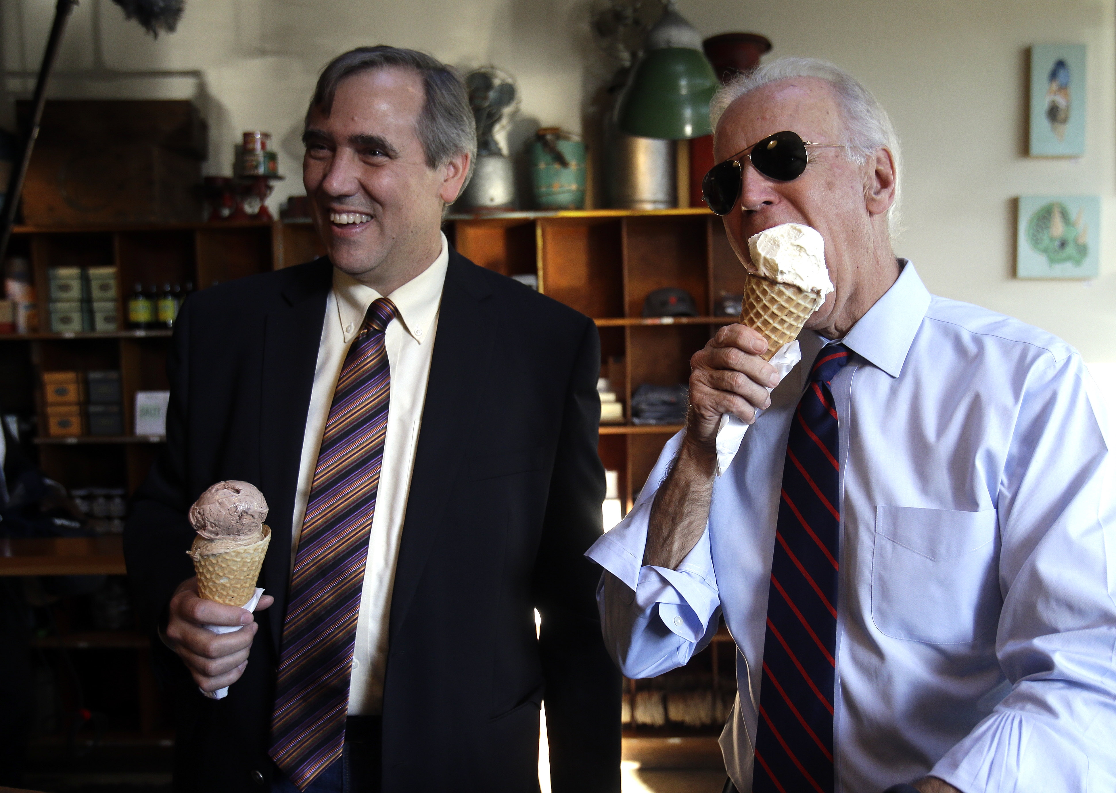 Vice President Joe Biden, right, and U.S. Sen. Jeff Merkley enjoy ice cream cones after a campaign rally in Portland, Ore., Wednesday, Oct. 8, 2014. (Don Ryan—AP)