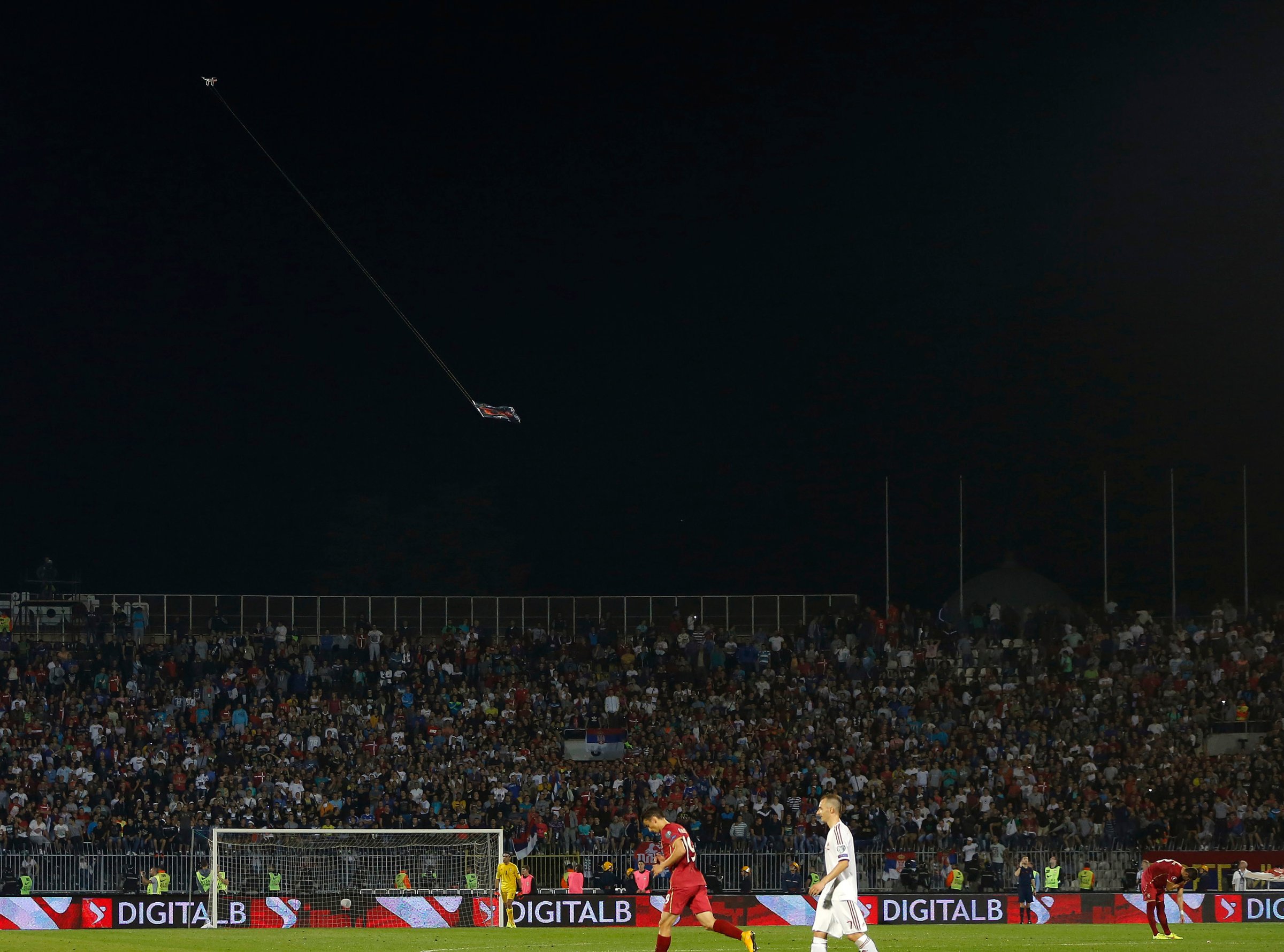 Mini drone carrying flag depicting so-called Greater Albania is flown over the pitch during their Euro 2016 Group I qualifying soccer match against Albania at the FK Partizan stadium in Belgrade