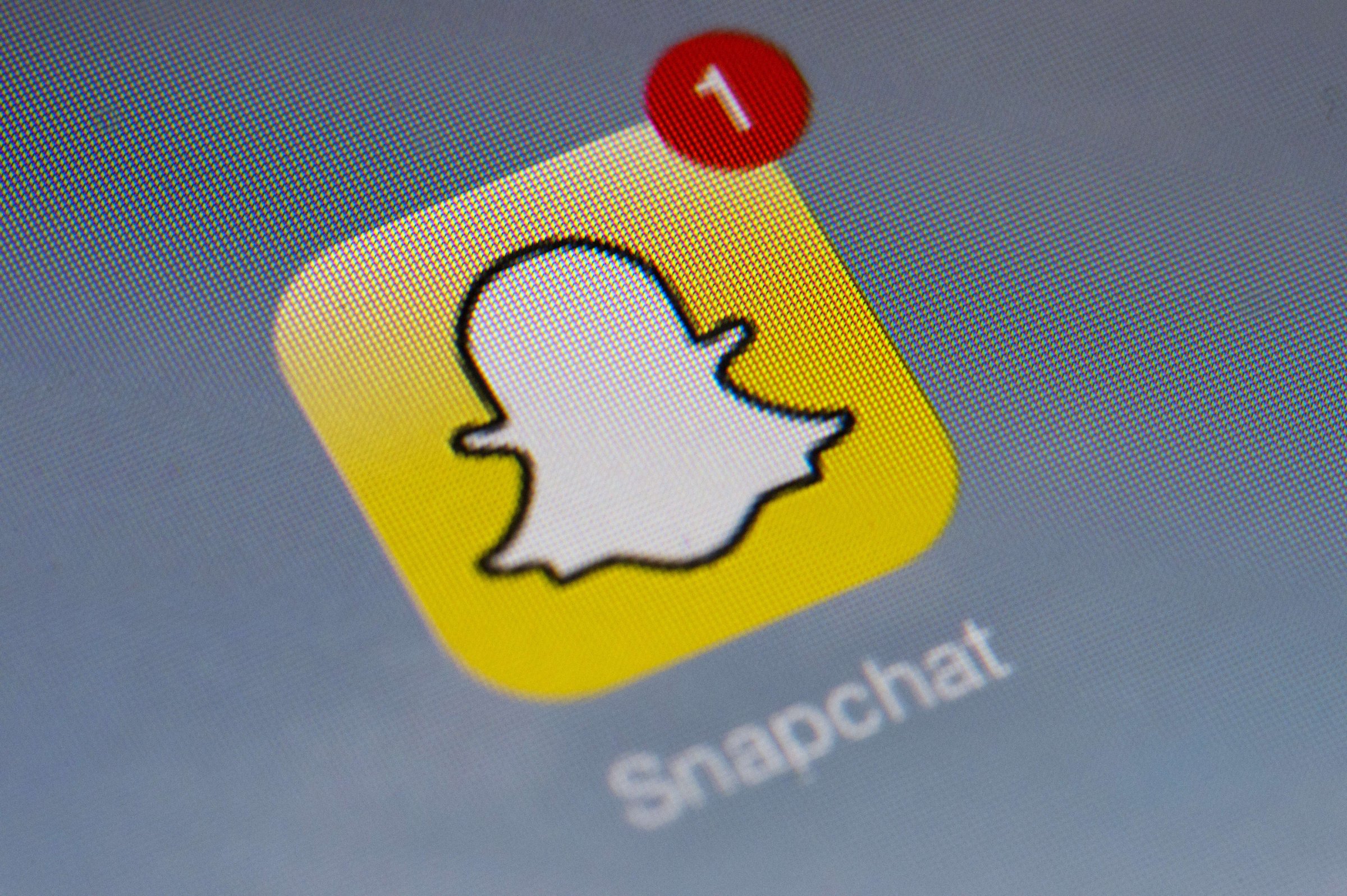 The logo of mobile app "Snapchat" is displayed on a tablet on January 2, 2014 in Paris.