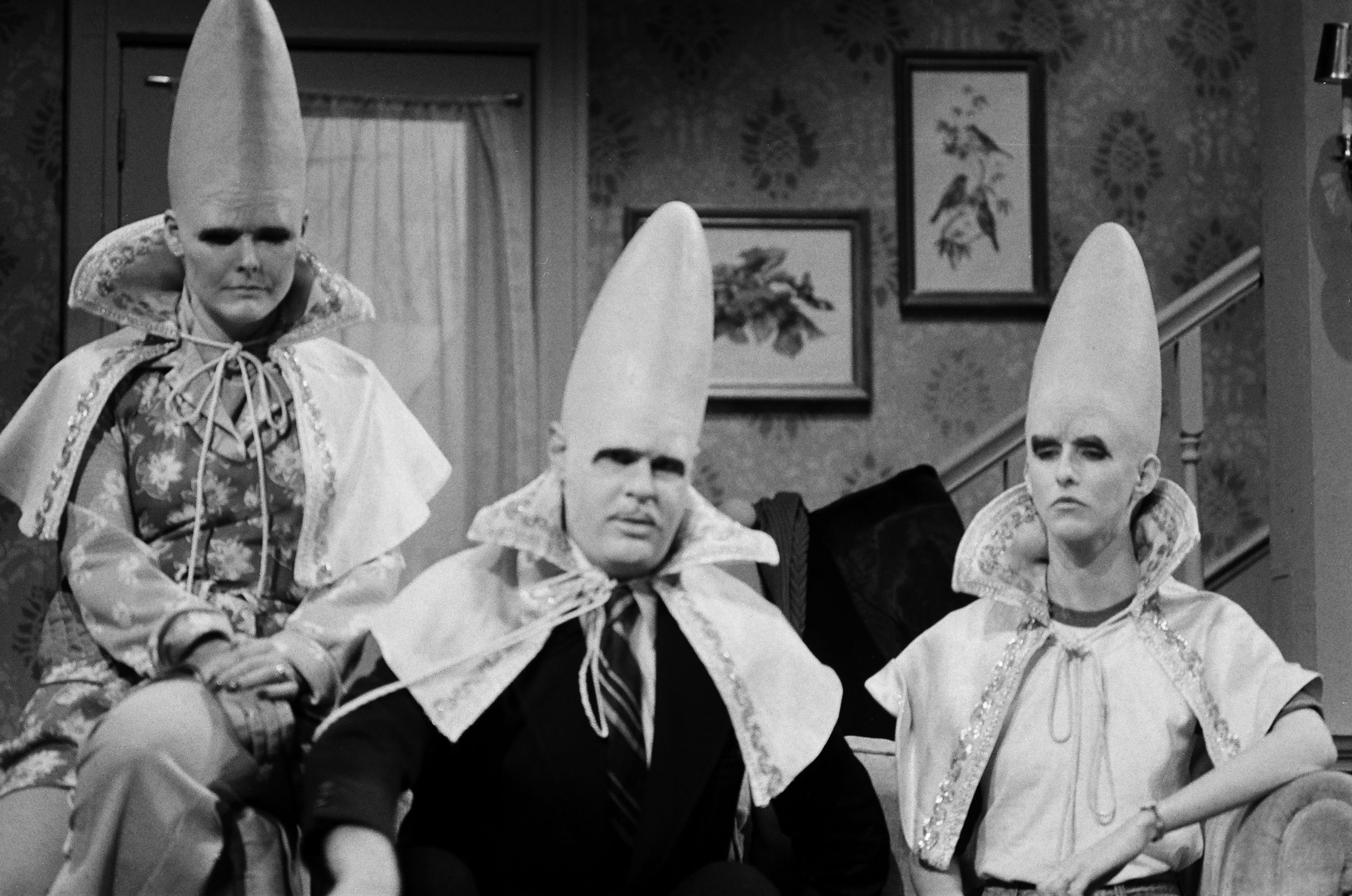 From left: Jane Curtin as Prymaat Conehead, Dan Aykroyd as Beldar Conehead and Laraine Newman as Connie Conehead during the The Coneheads at Home skit on Jan. 15, 1977. (NBC/Getty Images)