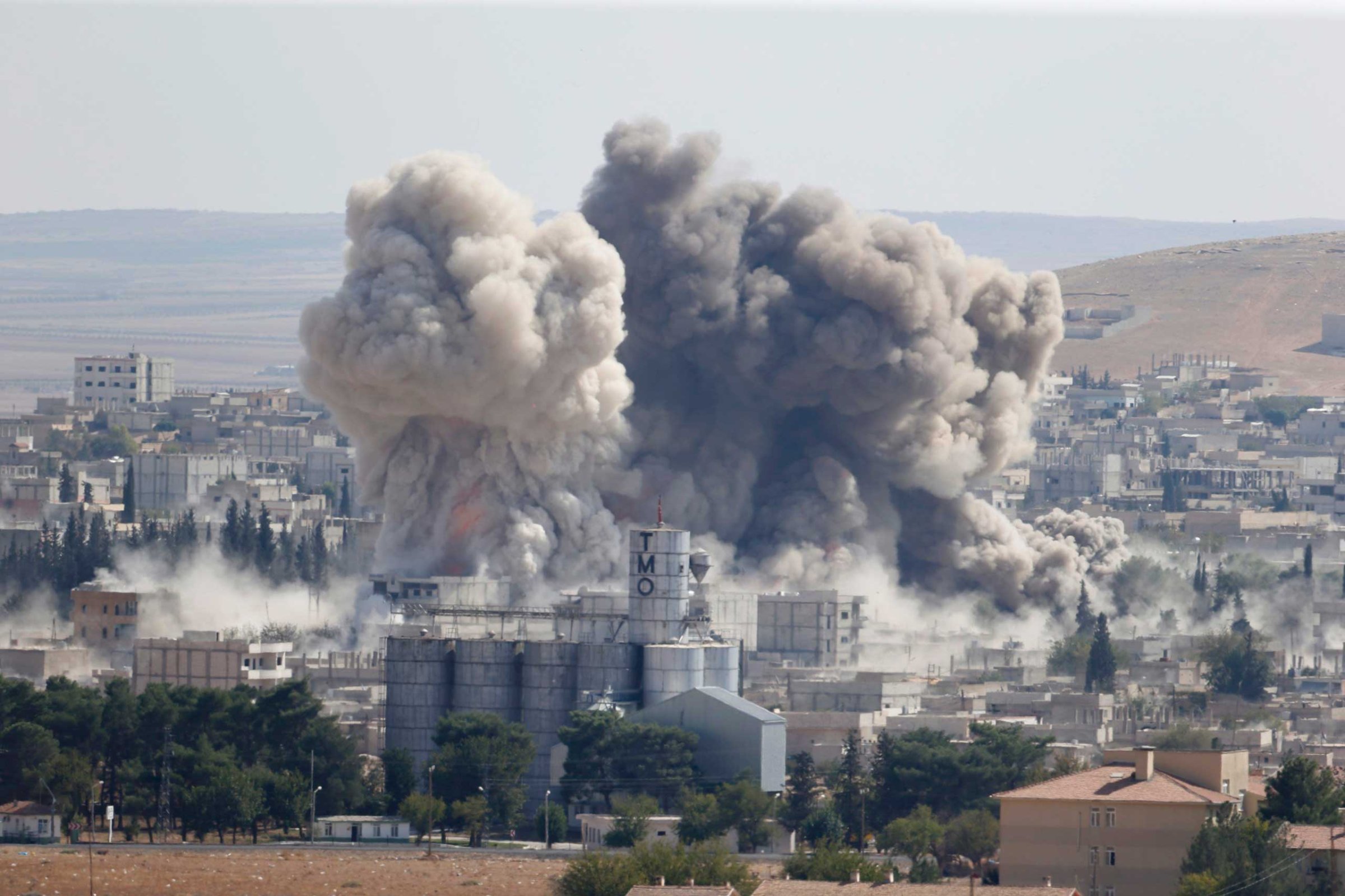 Smoke rises after an U.S.-led air strike in the Syrian town of Kobani, Oct. 8, 2014.