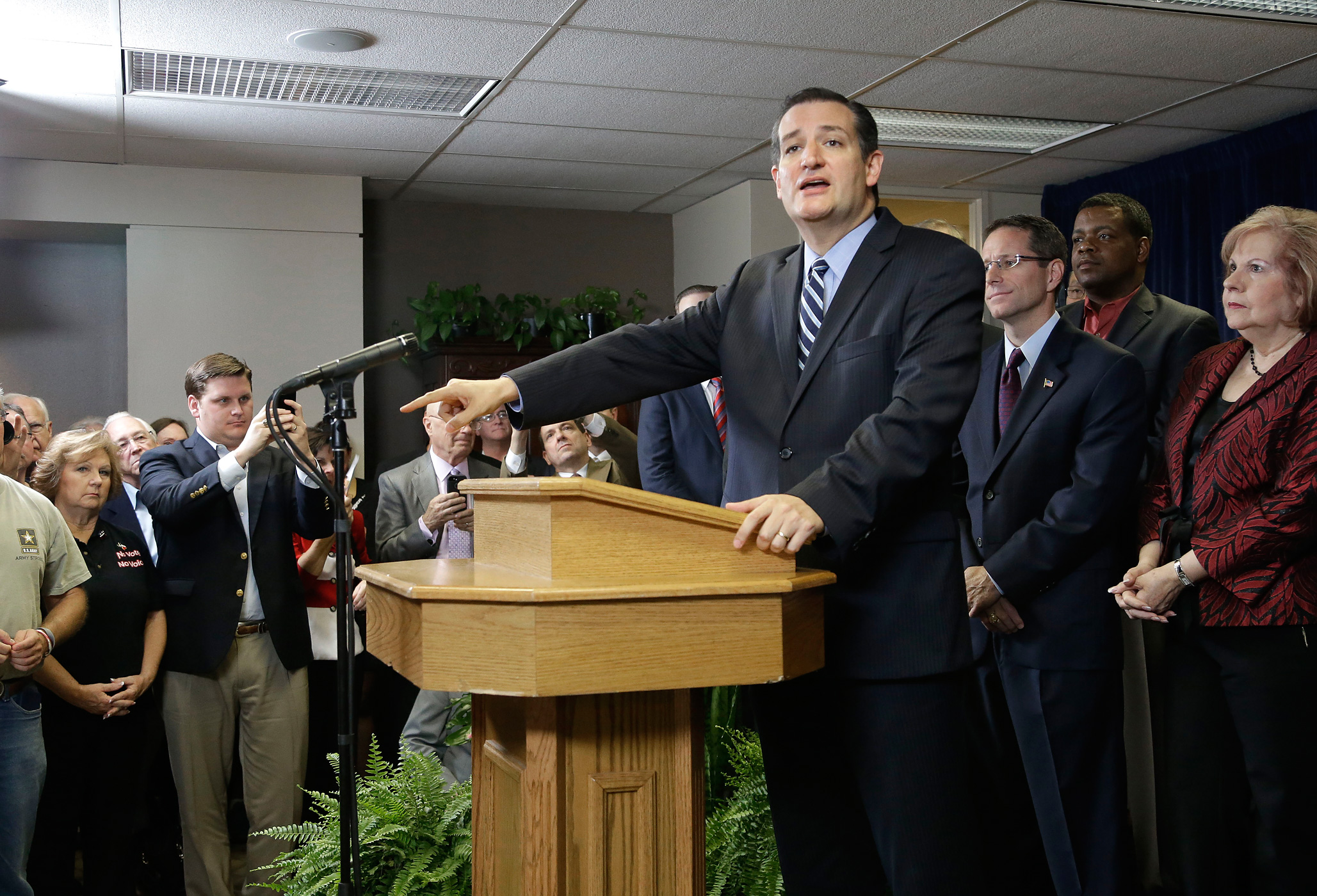 Sen. Ted Cruz is surrounded by preachers as he addresses a crowd at a Houston church Thursday, Oct. 16, 2014 about a legal dispute involving several pastors fighting subpoenas from Houston city attorneys. (Pat Sullivan—AP)