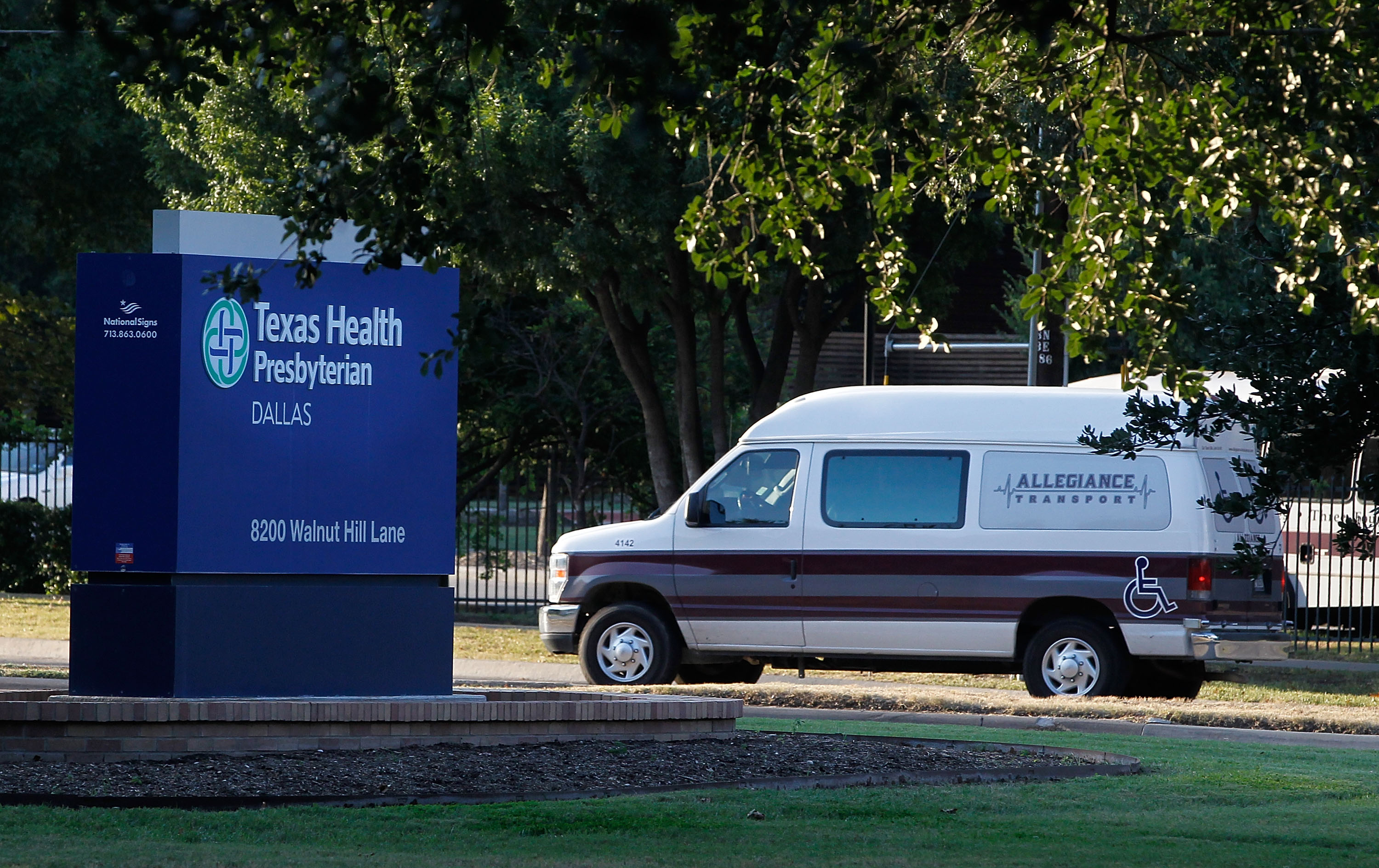 A medical transport van moves past Texas Health Presbyterian Hospital Dallas where a patient has been diagnosed with the Ebola virus on September 30, 2014 in Dallas, Texas. (Mike Stone—Getty Images)