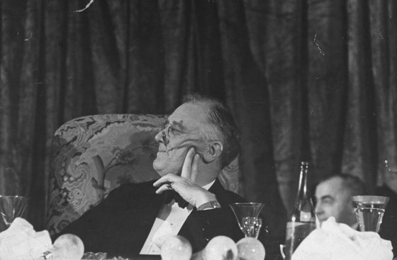 President Franklin Roosevelt listens to a speech during the annual Jackson Day fundraising dinner in Washington, DC. Originally published in the January 24, 1938, issue of LIFE.