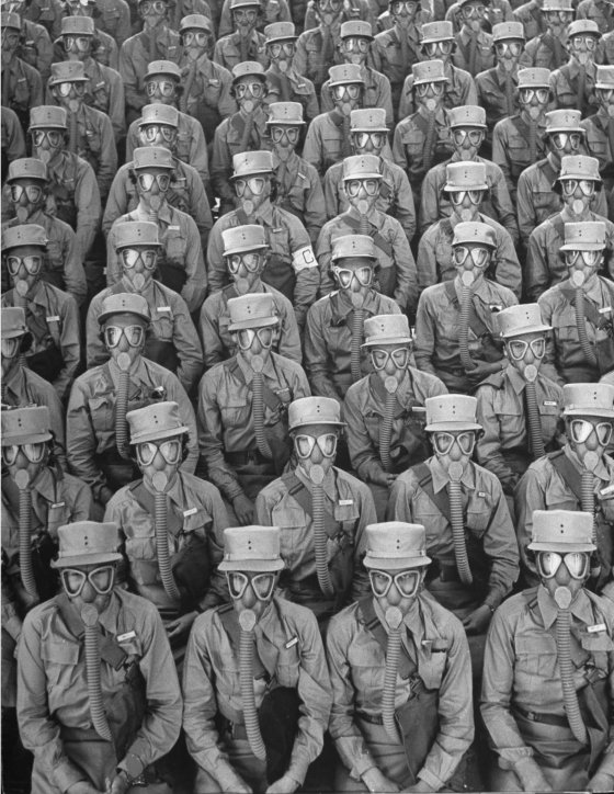 Row upon row of WACs (Women's Army Corps members) don gas masks for a training drill at Iowa's Fort Des Moines. Originally published in the September 7, 1942, issue of LIFE.