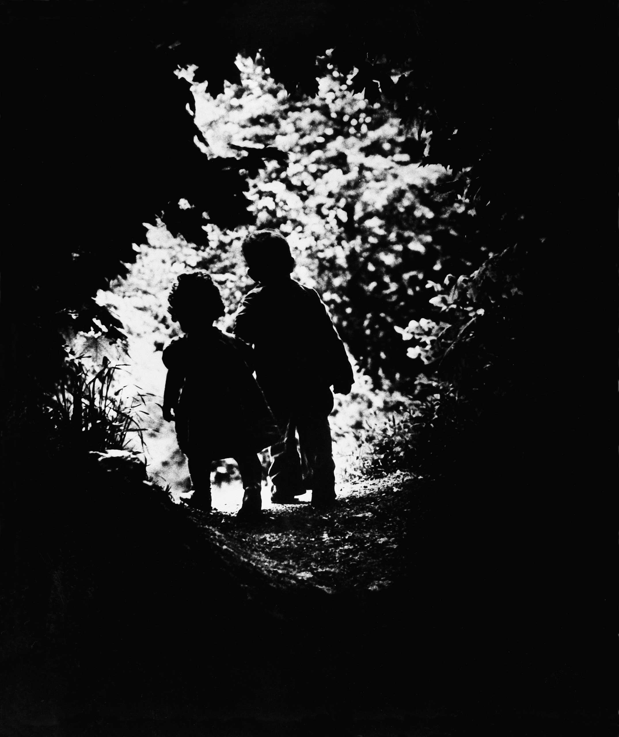 1946 | LIFE photographer W. Eugene Smith's children, Juanita and Patrick, walk hand-in-hand into a clearing in 1946. The photo was the closing image in Edward Steichen's now-legendary 1955 MoMA exhibition, The Family of Man, and was one of the very first that Smith, wounded while working in the Pacific in World War II, made after the war.