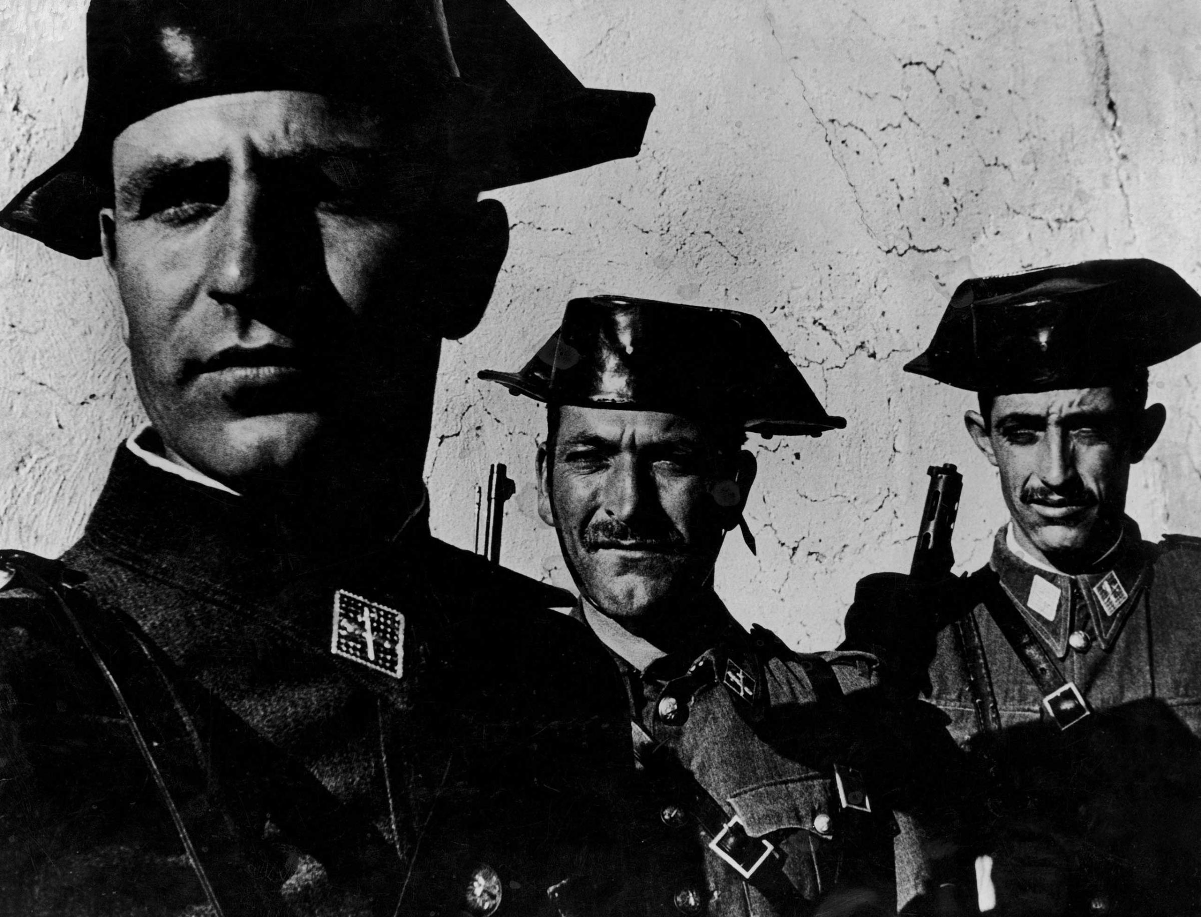 In the single most famous image from W. Eugene Smith's magisterial photo essay, "Spanish Village," the faces of three members of dictator Francisco Franco's feared Guardia Civil evince the arrogance often assumed by small men granted great power over others. Originally published in the April 9, 1951, issue of LIFE.