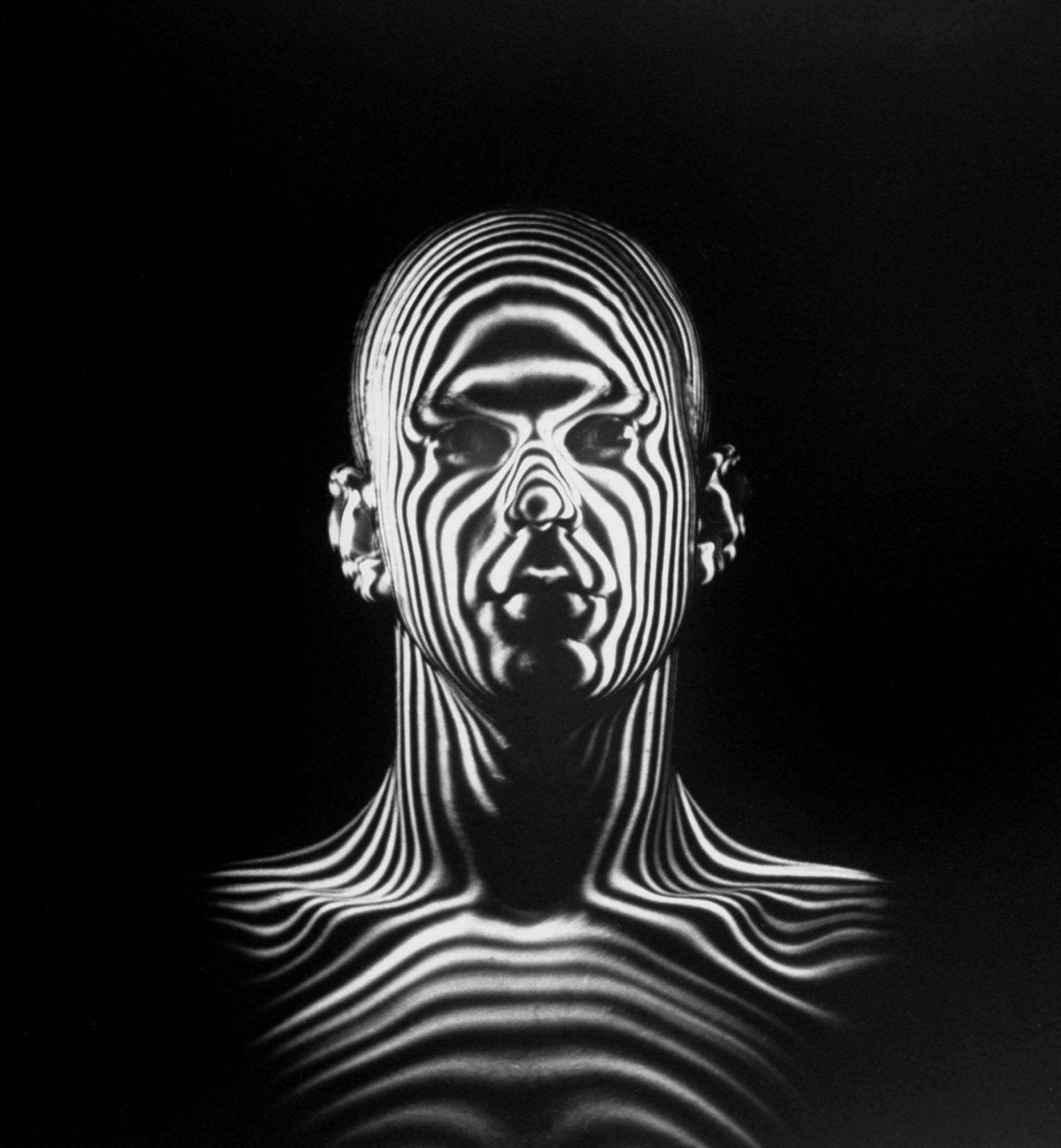 1954 | Light beams create a contour map of a human head during an Air Force study of jet-pilot helmets. Originally published, as the cover image, on the December 6, 1954, issue of LIFE.