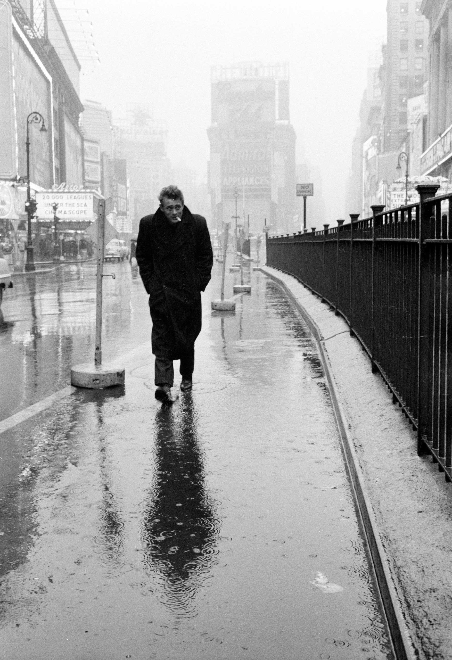 1955 | Hunkering against the cold and rain, a haunted-looking James Dean strolls through Times Square, mere blocks from the famous Actors Studio where he and other legends-to-be studied  the Method.  Originally published in the March 7, 1955, issue of LIFE.