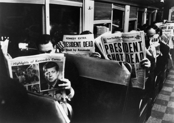 New York Commuters read of John F. Kennedy's assassination, November 1963. This Carl Mydans photo did not appear in LIFE when the magazine published as a weekly, but has been printed in later books.