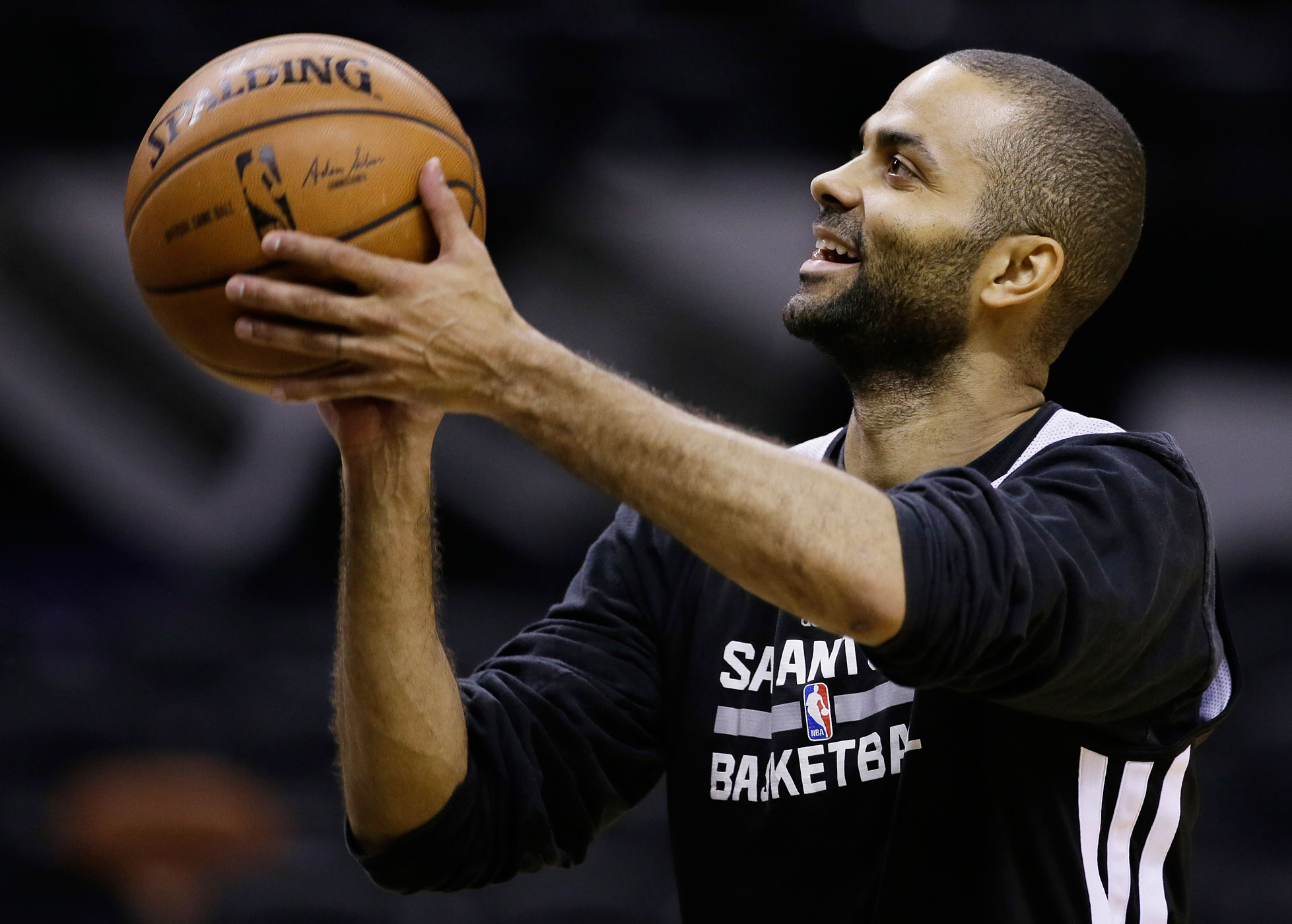 San Antonio Spurs guard Tony Parker is one of a record number of international players as the NBA season opens (Tony Gutierrez—AP)