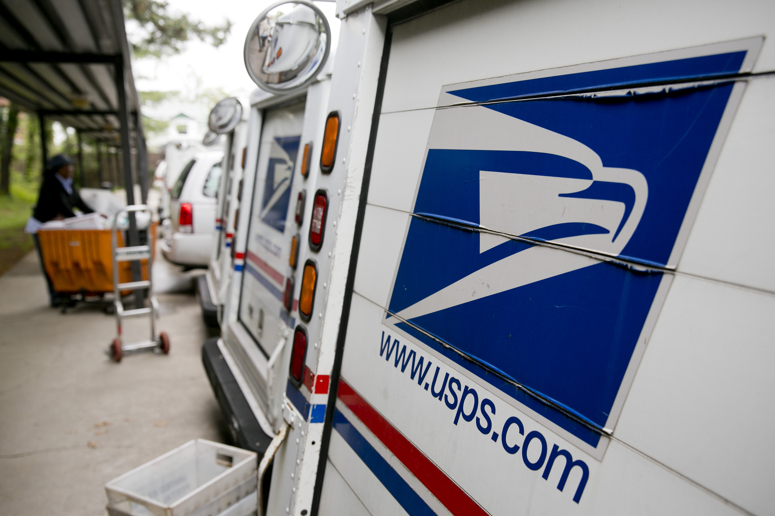 U.S. Postal Service delivery trucks sit at the Brookland Post Office in Washington, D.C. on May 9, 2013. (Bloomberg—Getty Images)
