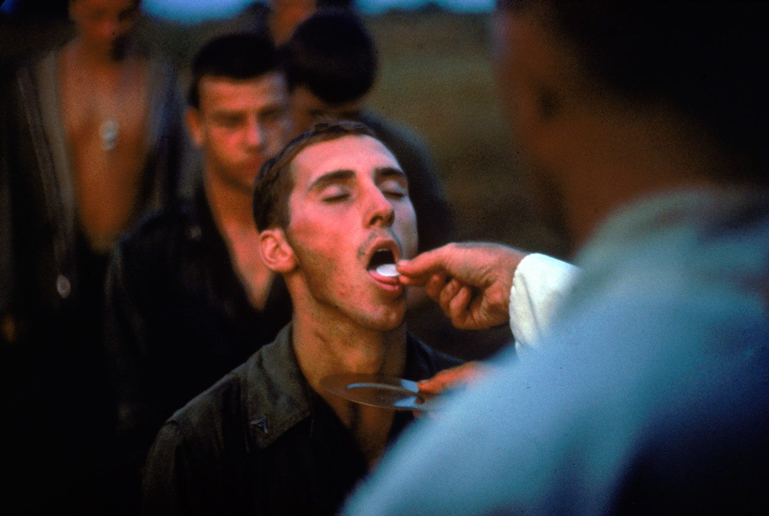 Not published in LIFE. American Marines receive the sacrament of Communion during a lull in the fighting near the DMZ during the Vietnam War, October 1966.