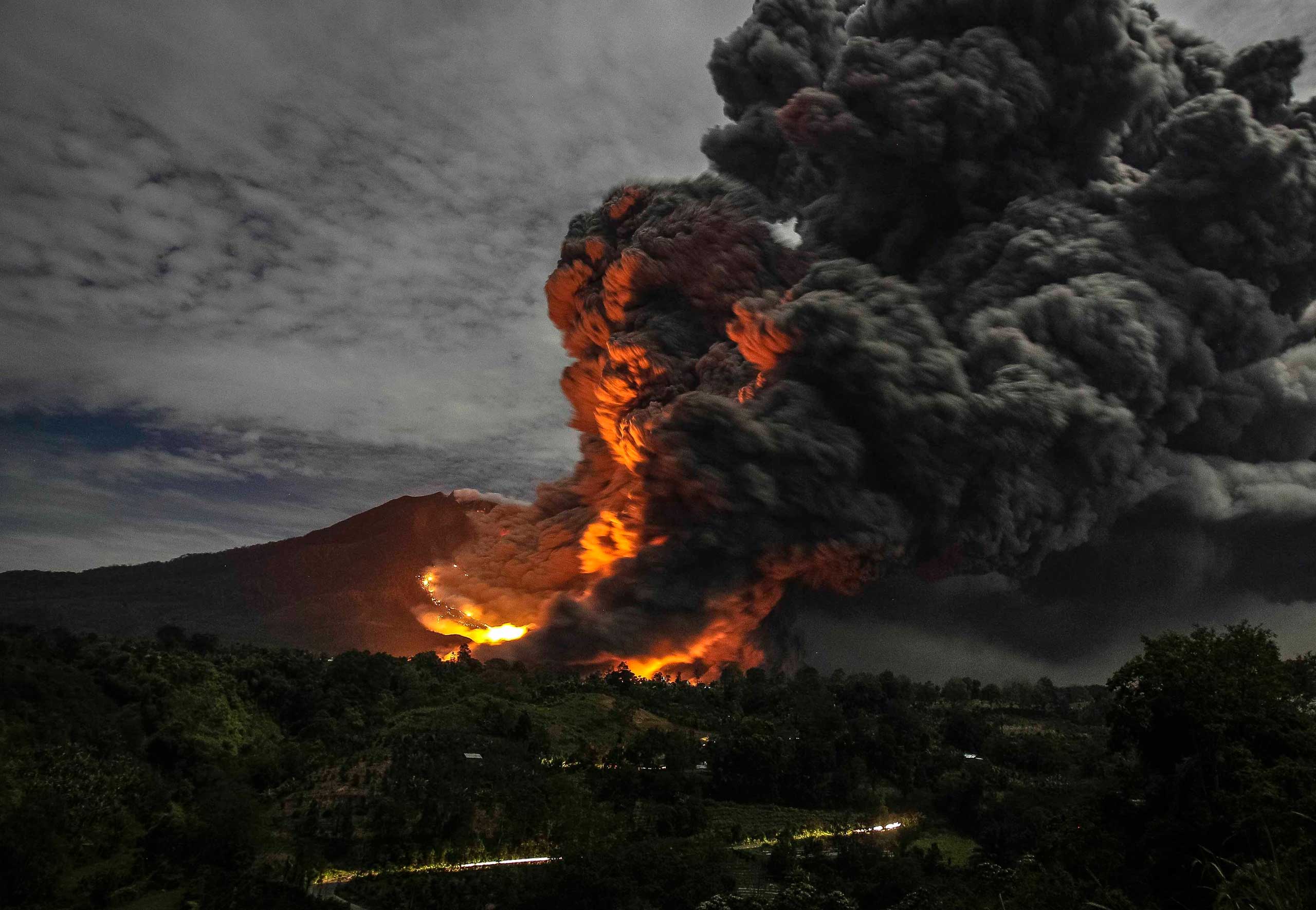 Mount Sinabung volcano erupts, as seen from Karo in Sumatra, Indonesia on Oct. 8, 2014.