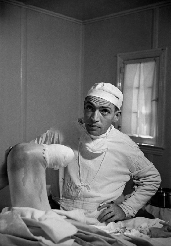 Not published in LIFE. Dr. Ceriani examines his handiwork after the partial amputation of a patient's leg, Kremmling, Colo., August 1948. The patient, Thomas Mitchell, was suffering from a gangrenous infection.